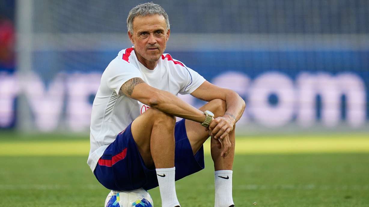 PSG's head coach Luis Enrique sits on a ball during a training session ahead of the UEFA Super Cup soccer match against Aston Villa in Salzburg, Austria, Tuesday, Aug. 11, 2026.