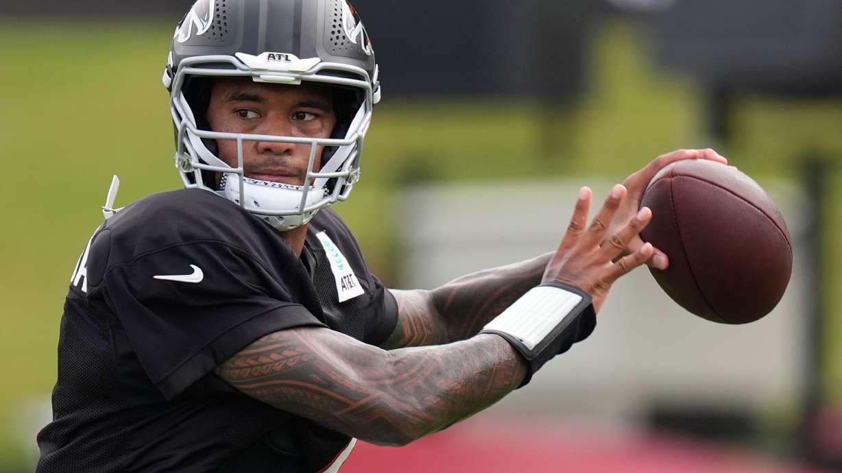 Atlanta Falcons quarterback Tua Tagovailoa (1) works out during an NFL training camp, Friday, Aug. 7, 2026, in Flowery Branch, Ga.