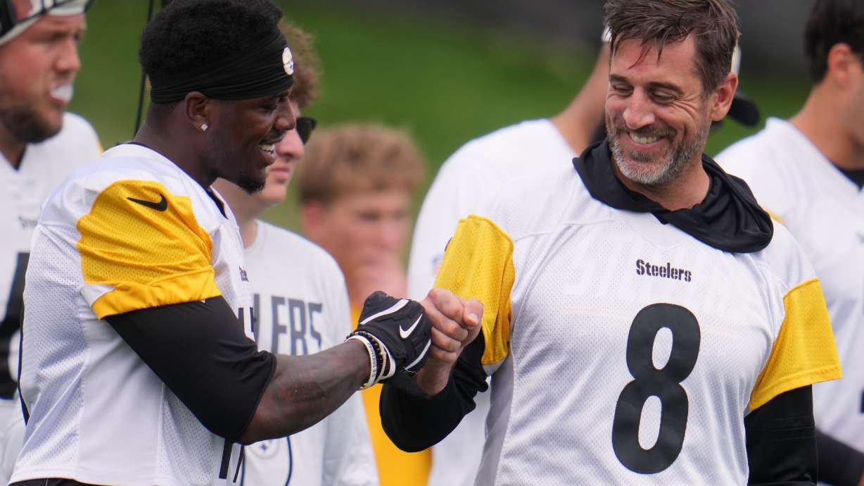 Pittsburgh Steelers quarterback Aaron Rodgers (8) fist bumps wide receiver Germie Bernard, left during the NFL team's training camp in Latrobe, Pa., Saturday, Aug. 1, 2026.
