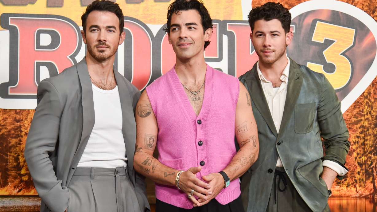 Kevin Jonas, from left, Joe Jonas, and Nick Jonas arrive at the premiere of "Camp Rock 3" on Monday, Aug. 10, 2026, at The Walt Disney Studios in Burbank, Calif.