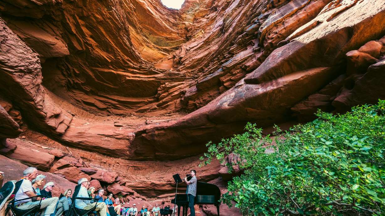 A captive audience enjoys music during the Grotto Concert, part of the Moab Music Festival in 2025. The festival combines music and nature for a series of indoor and outdoor performances featuring chamber music, jazz, Latin music and more.