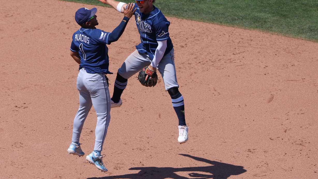 Tampa Bay Rays' Richie Palacios (1) and Taylor Walls, right, celebrate after the final out of a baseball game as the Rays defeat the Athletics Wednesday, Aug. 12, 2026, in West Sacramento, Calif.