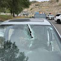 Driver critically injured after being struck by pole that fell from pickup truck