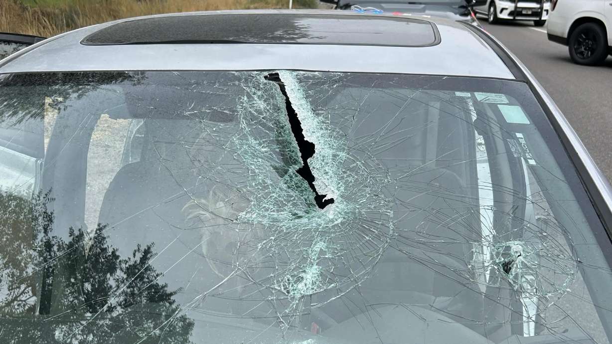 The damage left from a metal pole that went through a Honda Civic's windshield, critically injuring the driver, Monday.