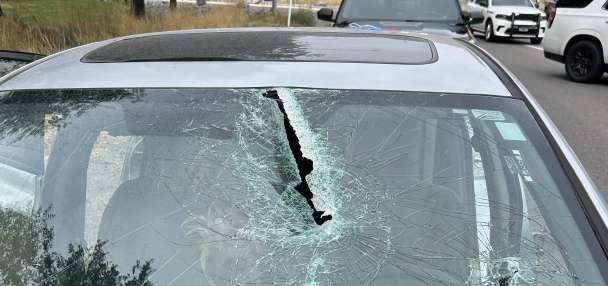Driver critically injured after being struck by pole that fell from pickup truck