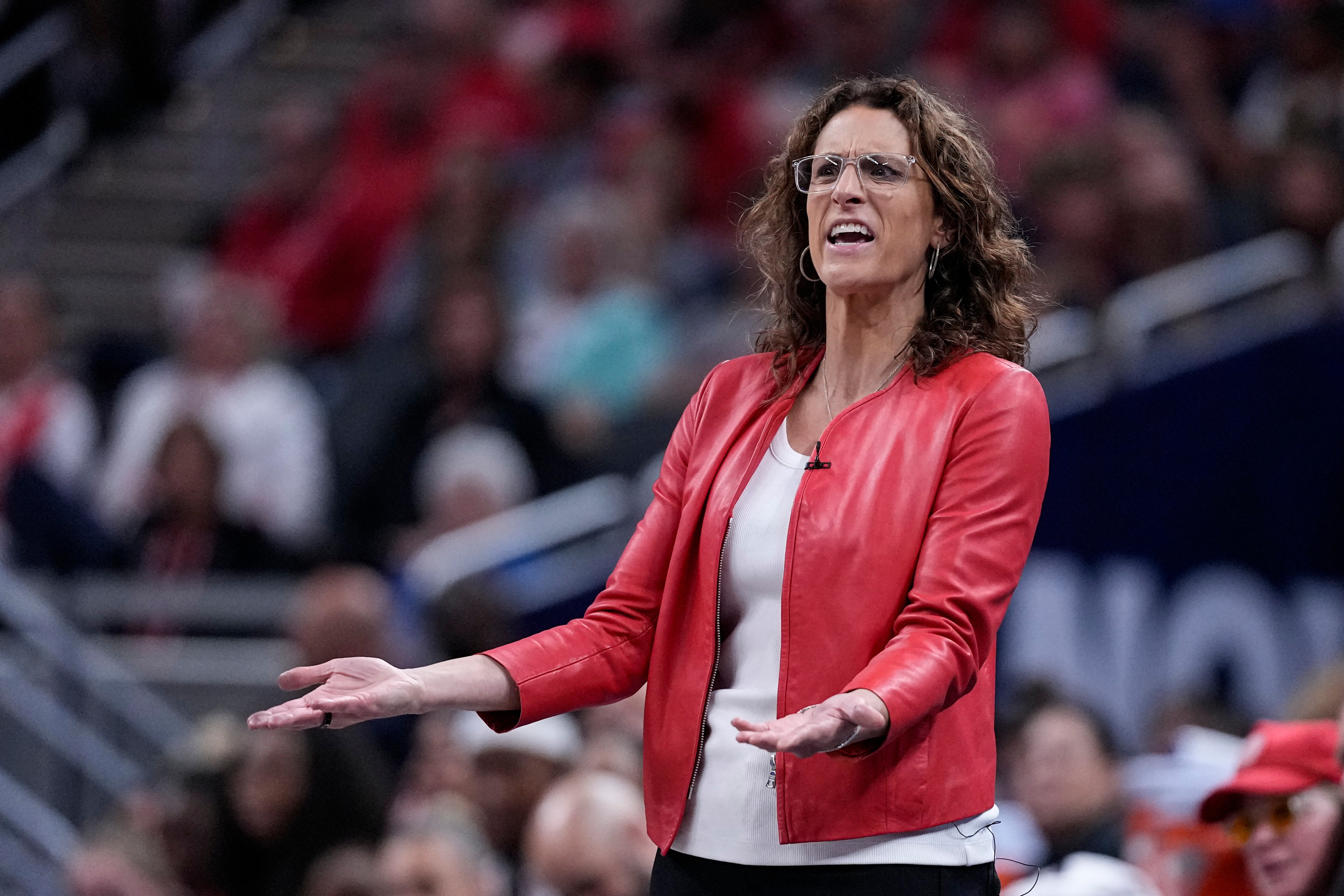 Indiana Fever head coach Stephanie White questions a call in the second half of a WNBA basketball game against the New York Liberty in Indianapolis, Tuesday, Aug. 11, 2026. 