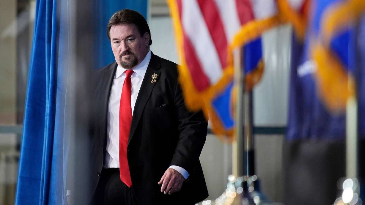 Nevada GOP chair Michael McDonald walks on stage before speaking ahead of Republican presidential candidate former President Donald Trump at a campaign event, Jan. 27, 2024, in Las Vegas.