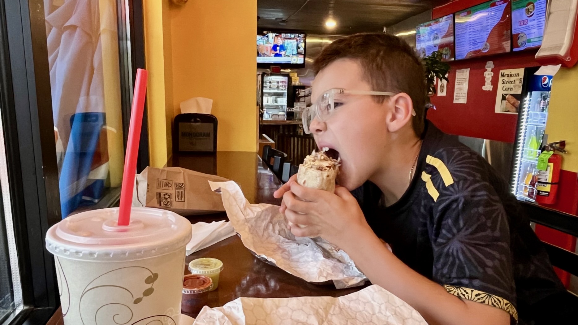 Jake Palma and son Carson are on a whirlwind trip around Utah, trying Mexican food in each of the state's 29 counties. Carson is pictured Wednesday at Gilibertos, a Mexican restaurant in Moab.