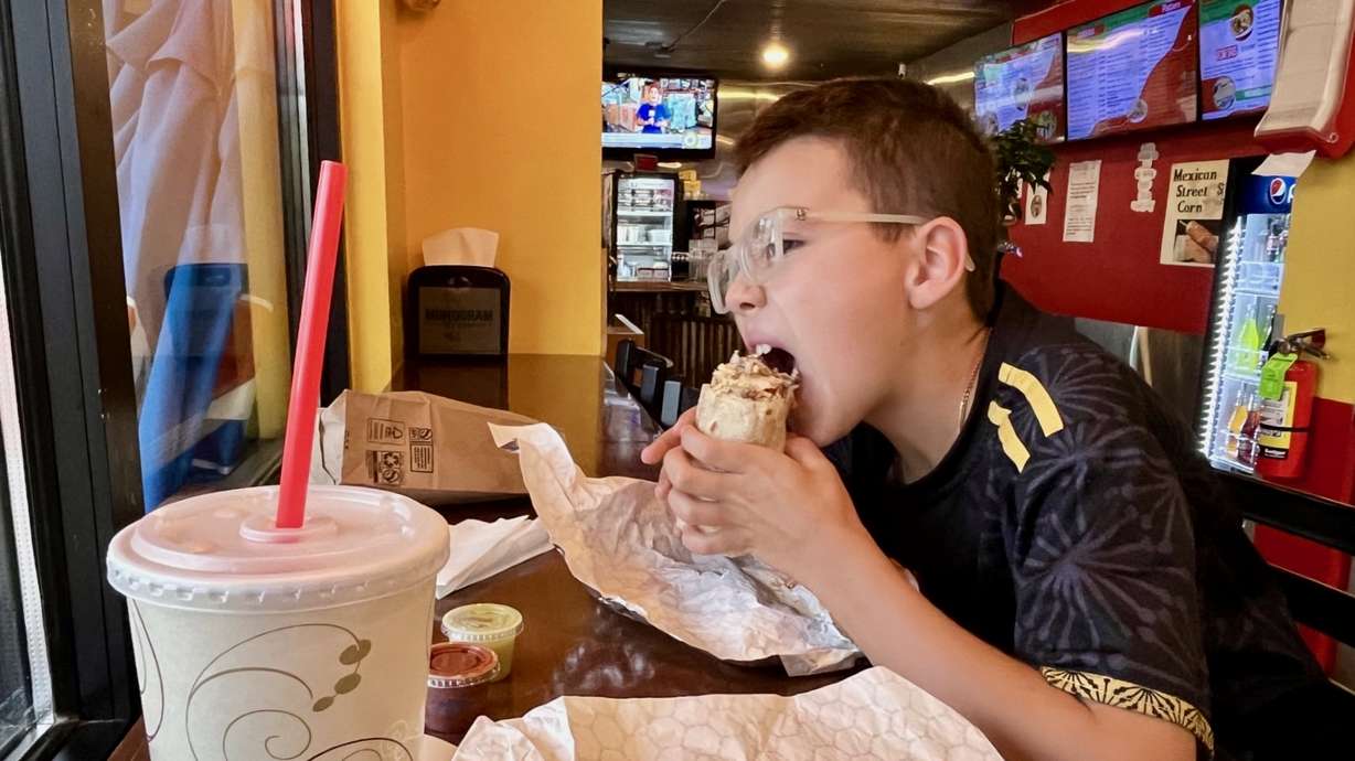 Jake Palma and son Carson are on a whirlwind trip around Utah, trying Mexican food in each of the state's 29 counties. Carson is pictured Wednesday at Gilibertos, a Mexican restaurant in Moab.