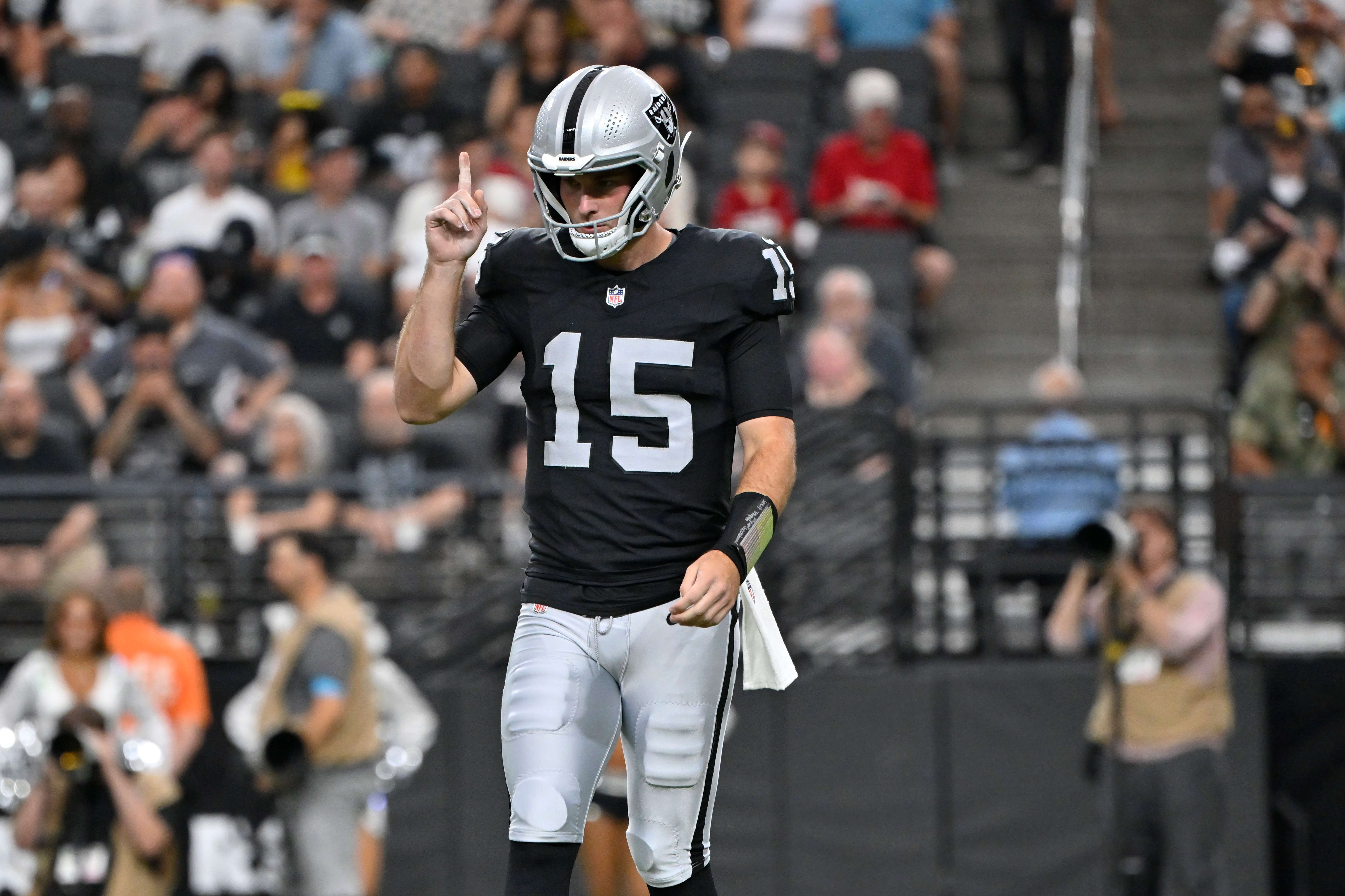 Las Vegas Raiders quarterback Fernando Mendoza (15) pauses on the field during the first half of a preseason NFL football game against the Arizona Cardinals, Thursday, Aug. 13, 2026, in Las Vegas. 