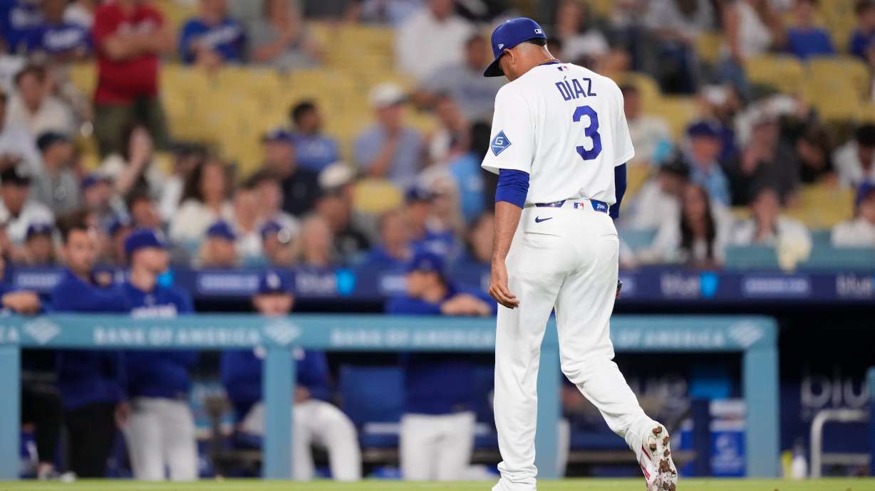 Los Angeles Dodgers pitcher Edwin Díaz walks off the field after being taken out of the game during the ninth inning of a baseball game against the Milwaukee Brewers, Thursday, Aug. 13, 2026, in Los Angeles.