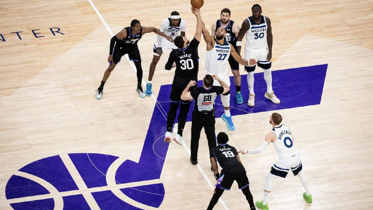 Minnesota Timberwolves center Rudy Gobert (27) and Utah Jazz center Jusuf Nurkić (30) compete for the opening tipoff during an NBA game held at the Delta Center in Salt Lake City on Jan. 20.