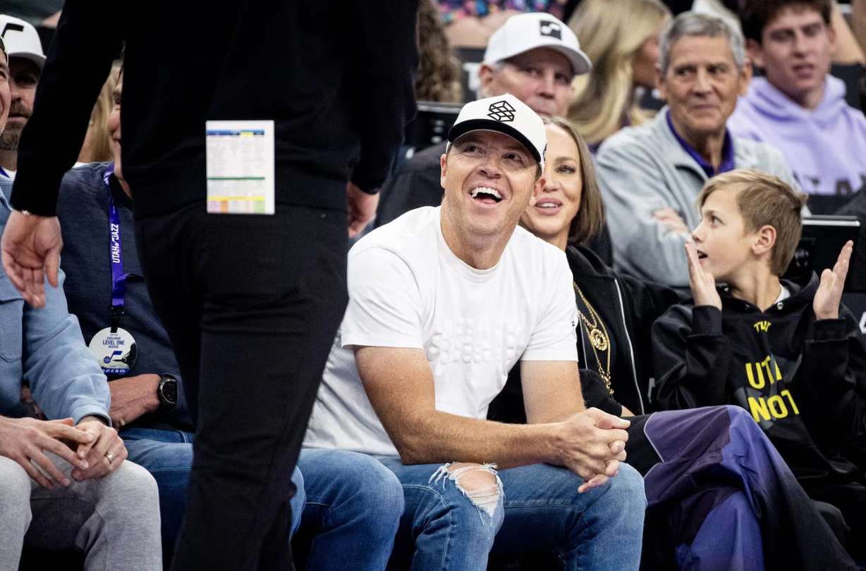 Utah Jazz owner Ryan Smith smiles as he looks to head coach Will Hardy during an NBA game against the Brooklyn Nets held at the Delta Center in Salt Lake City on Jan. 30.