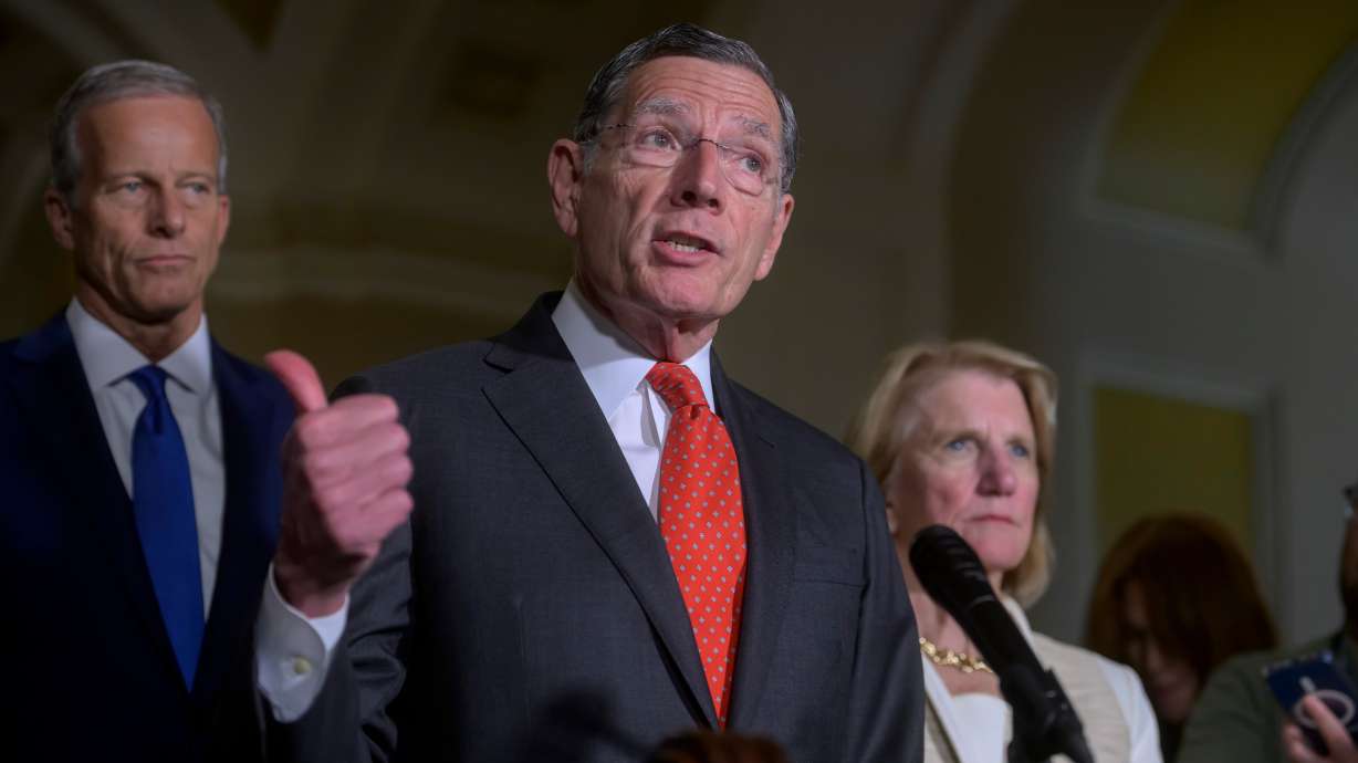 Sen. John Barrasso, R-Wyo., center, is joined by Senate Majority Leader John Thune, R-S.D., left, and Sen. Shelley Moore Capito, R-W.Va., right, during the Senate Republican policy luncheon news conference at the Capitol, May 19, in Washington.