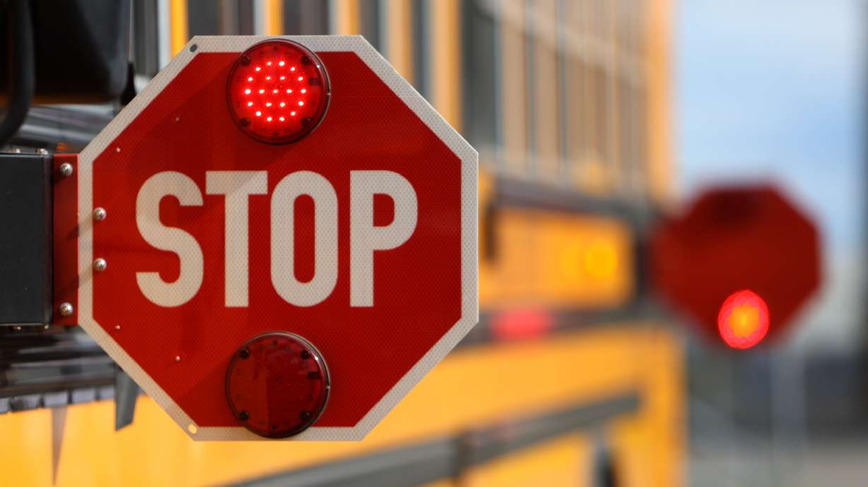 Stop signs are pictured on a school bus at Salt Lake City School District Transportation in Salt Lake City on Aug. 13, 2024. Timpanogos School District signed an agreement with Aspen Peaks School District this week to collaboratively manage student transportation needs ahead of the districts becoming operational in 2027.