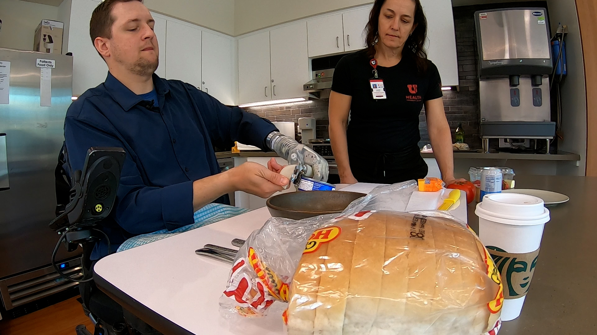 Alexander "Avi" Davidson, a therapist from Tampa, Florida, and occupational therapist Leanne Seckinger make a tuna melt sandwich on April 17.