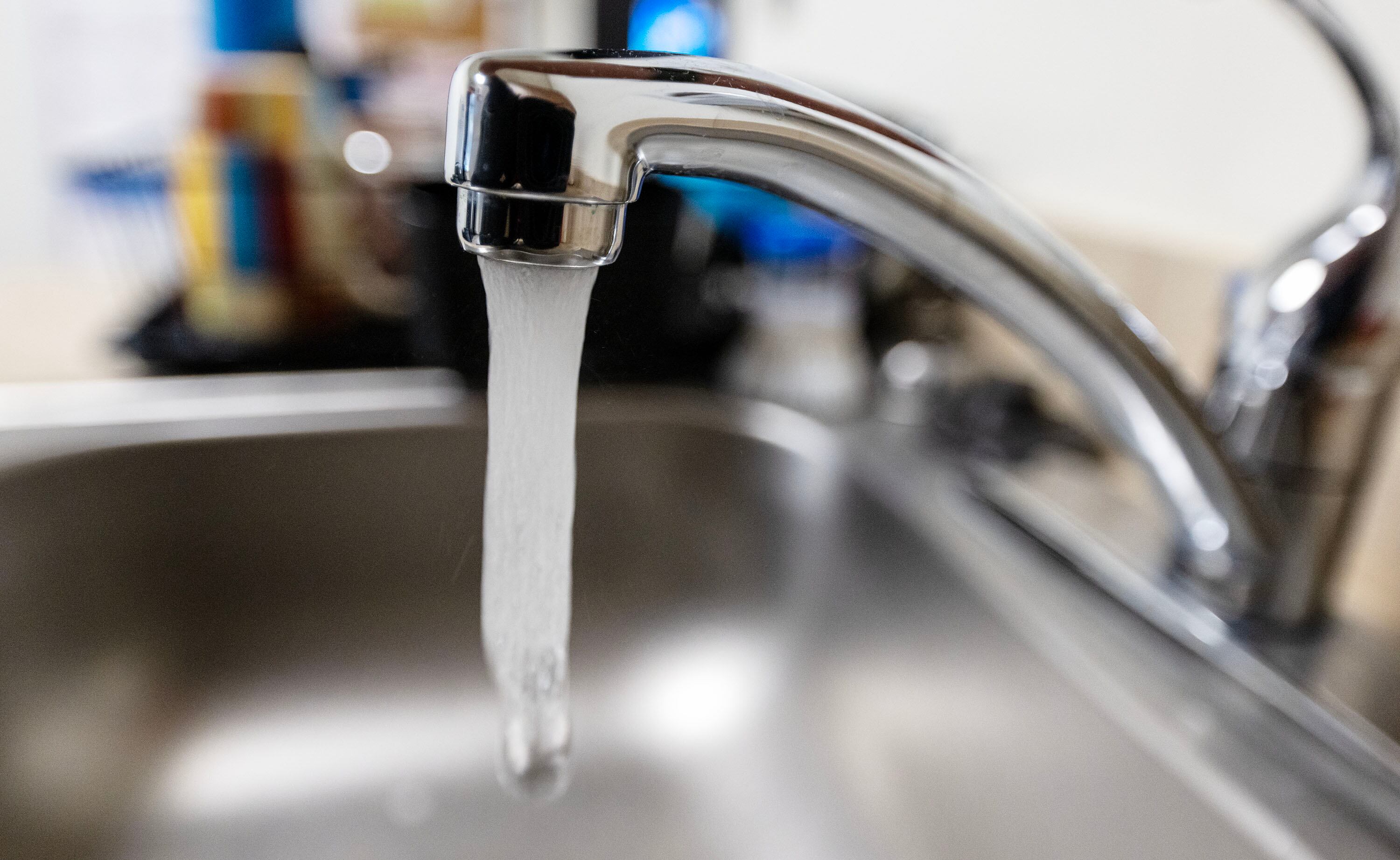 Water runs through a faucet in Salt Lake City on March 31, 2025.