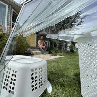 Sandy cleans up after '100-year' rainstorm leaves flood damage