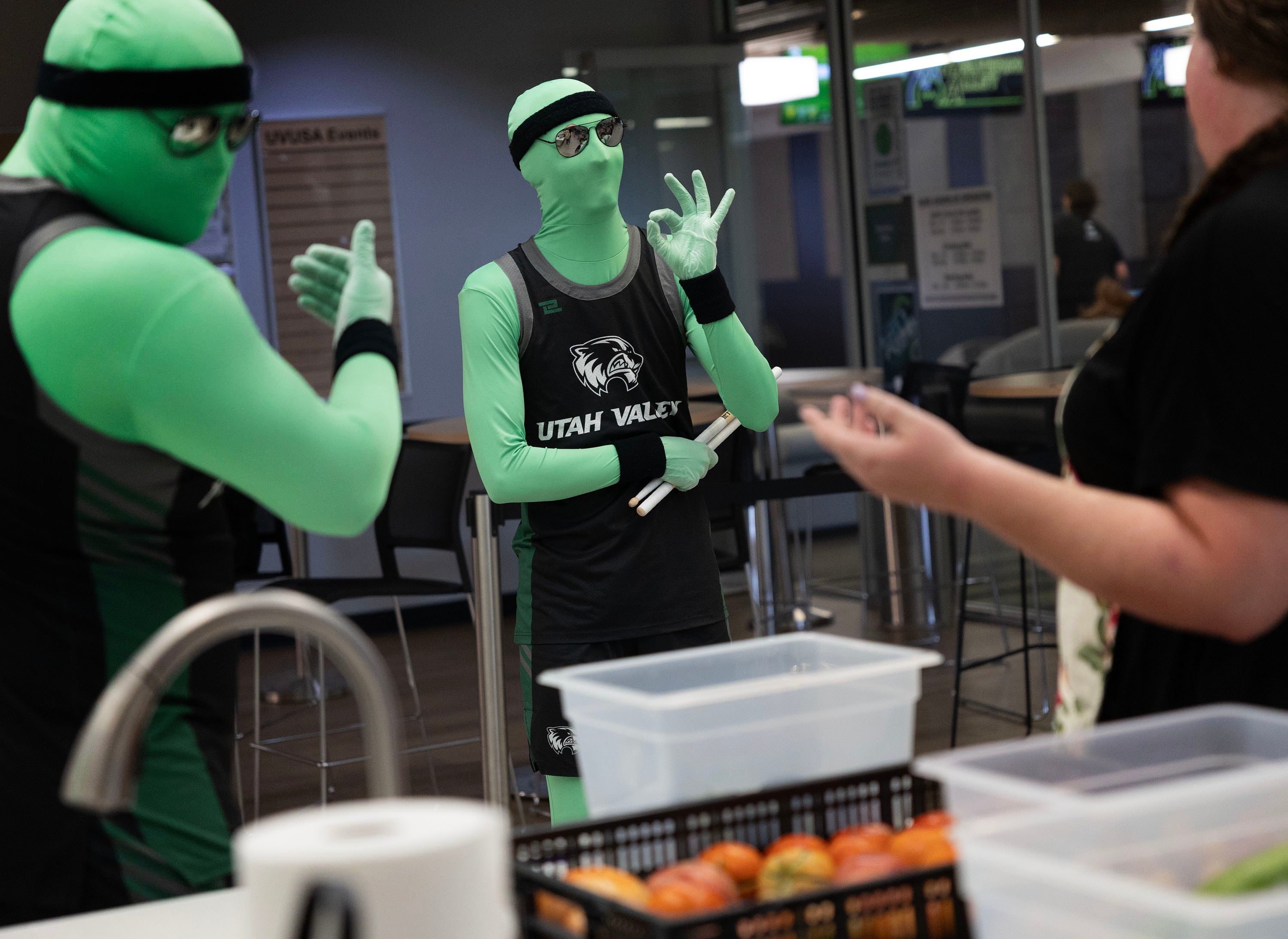 Amanda Kimball accepts kudos from a few Green Man Group members after cooking zucchini pasta with a roasted caprese crown during a Fresh Food Friday budget cooking class at Utah Valley University in Orem on Friday.