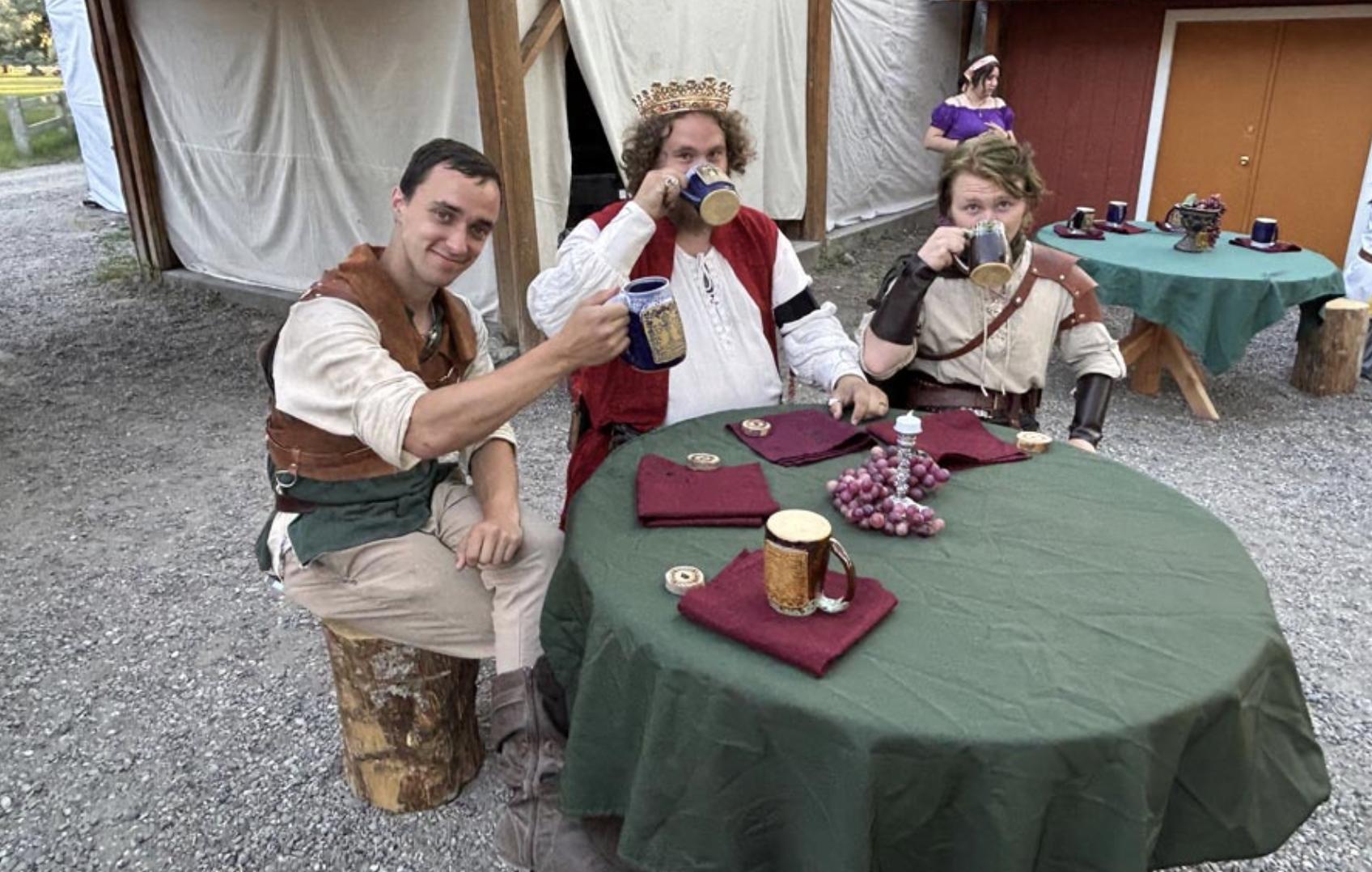 The king and members of his court share a drink at Thornshire Renaissance Faire King’s Feast.