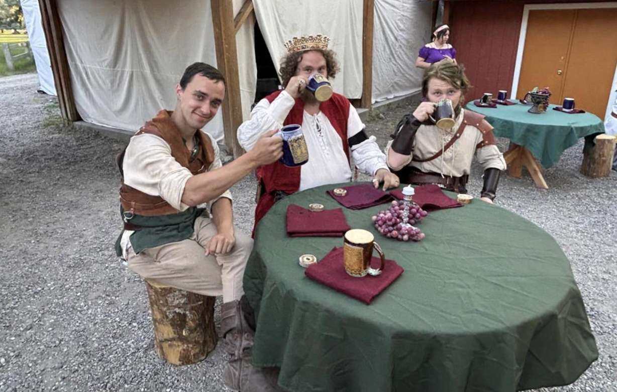 The king and members of his court share a drink at Thornshire Renaissance Faire King’s Feast.