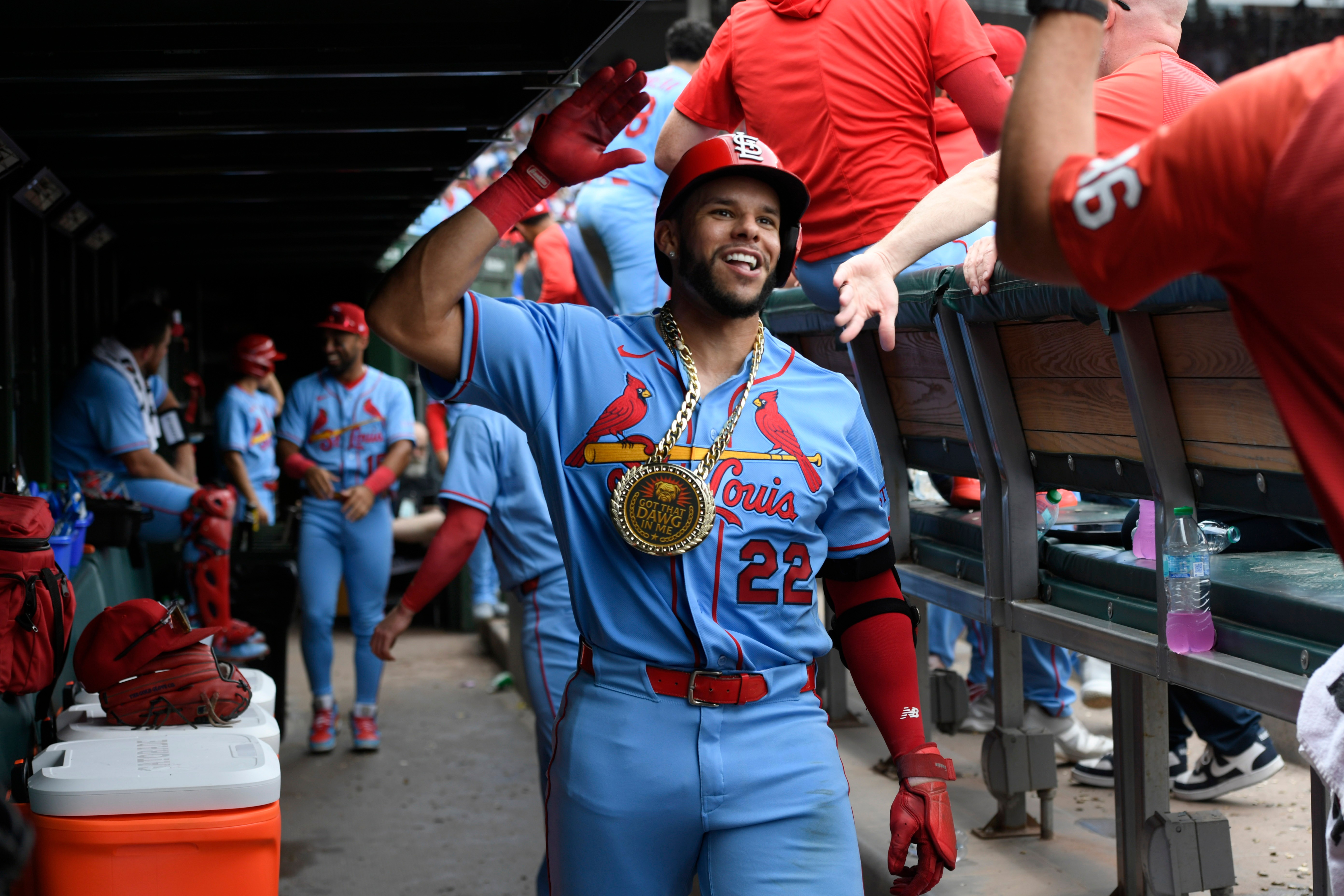 St. Louis Cardinals' Joshua Baez (22) celebrates with teammates in the dugout after hitting a solo home run during the fourth inning of a baseball game against the Chicago Cubs in Chicago, Saturday, Aug. 15, 2026. 