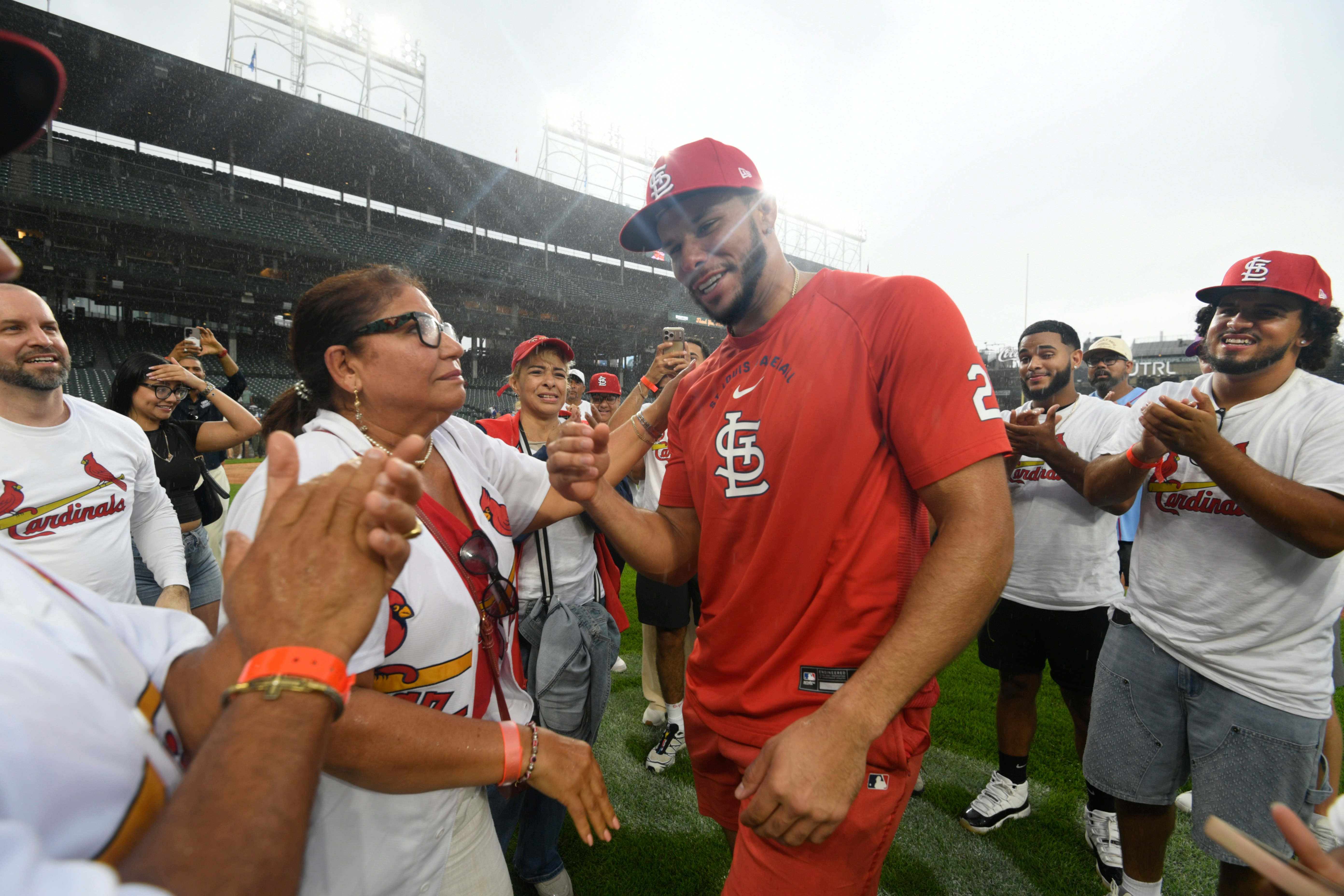St. Louis Cardinals' Joshua Baez, right, celebrates with his mother Yris Carmen Baez, left, after defeating the Chicago Cubs in a baseball game in Chicago, Saturday, Aug. 15, 2026. 