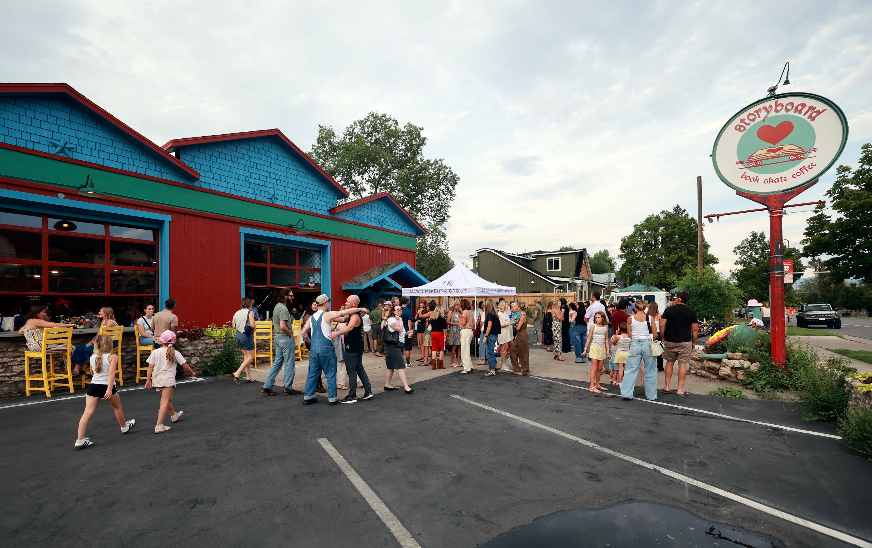 People attend a book release event for Claire Carusillo’s novel “The Responsible Party,” at Storyboard book, skate and coffee shop in Midway on Aug. 10. Carusillo recently opened Storyboard with Galen DeKemper.