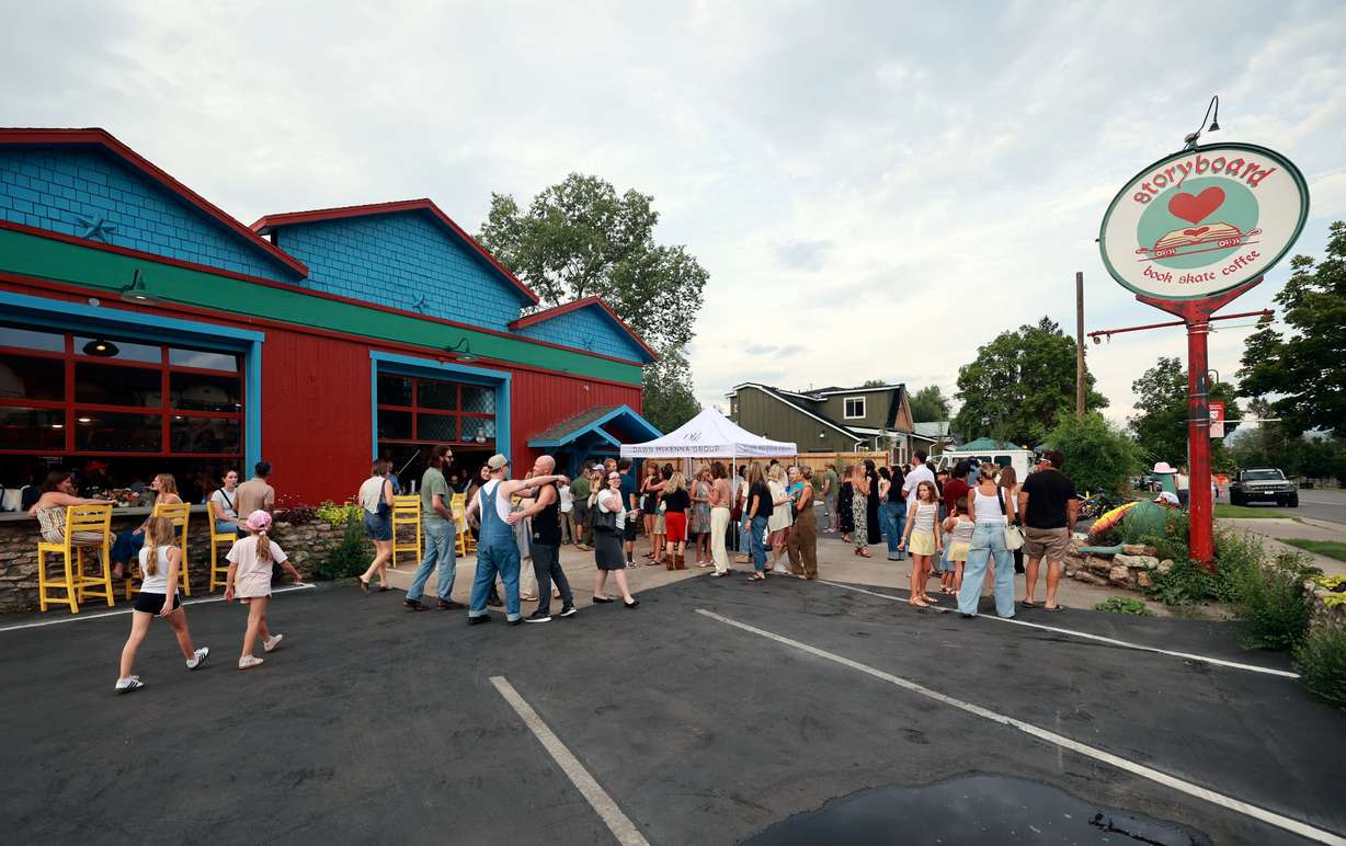 People attend a book release event for Claire Carusillo’s novel “The Responsible Party,” at Storyboard book, skate and coffee shop in Midway on Aug. 10. Carusillo recently opened Storyboard with Galen DeKemper.