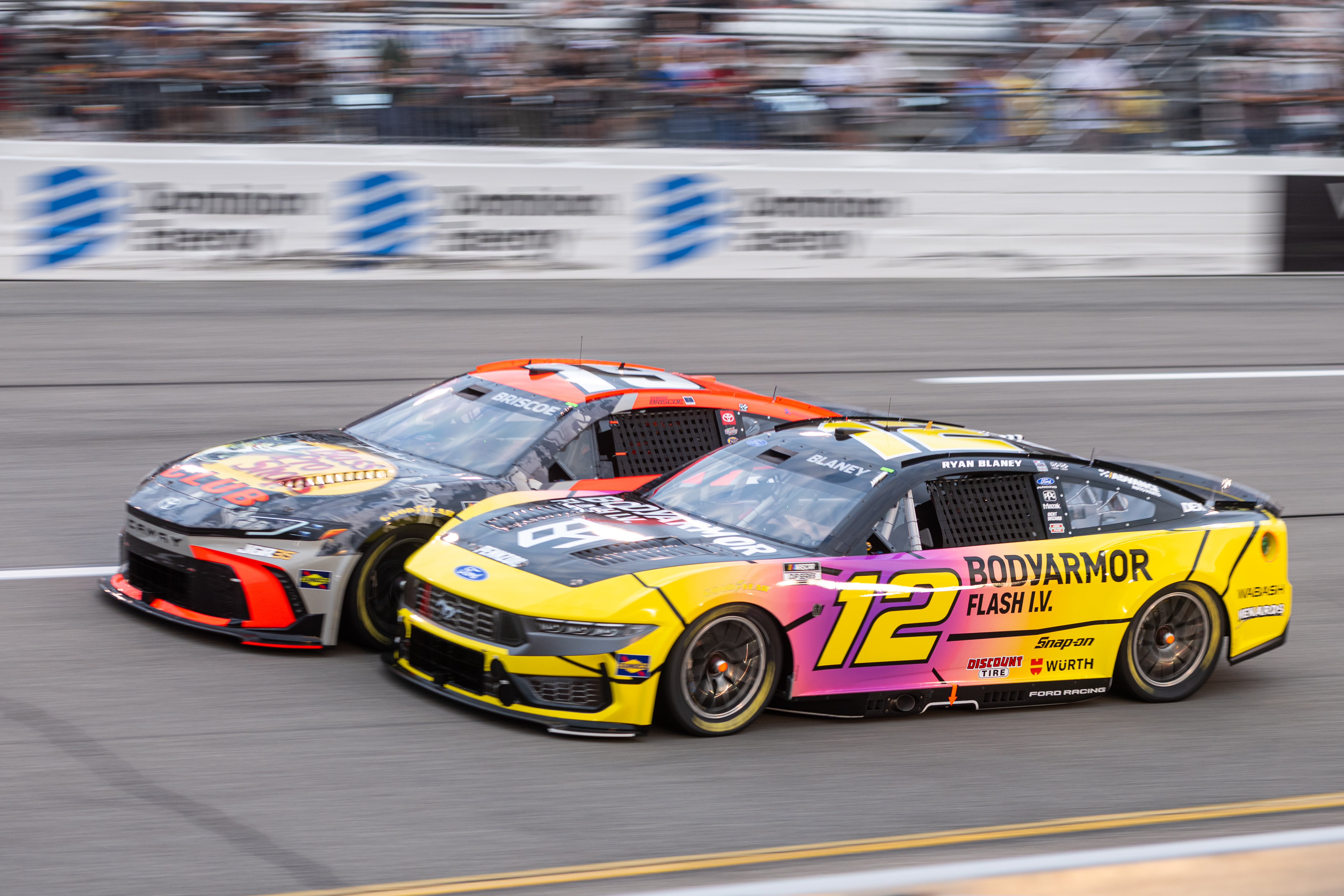 Team Penske driver Ryan Blaney (12) and Joe Gibbs Racing driver Chase Briscoe (19) battle in turn one during Cook Out 400 at Richmond Raceway, Saturday, Aug. 15, 2026, in Richmond Va. 