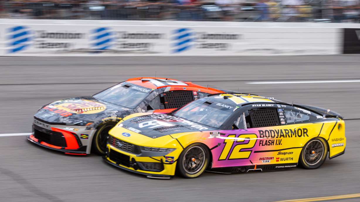 Team Penske driver Ryan Blaney (12) and Joe Gibbs Racing driver Chase Briscoe (19) battle in turn one during Cook Out 400 at Richmond Raceway, Saturday, Aug. 15, 2026, in Richmond Va.