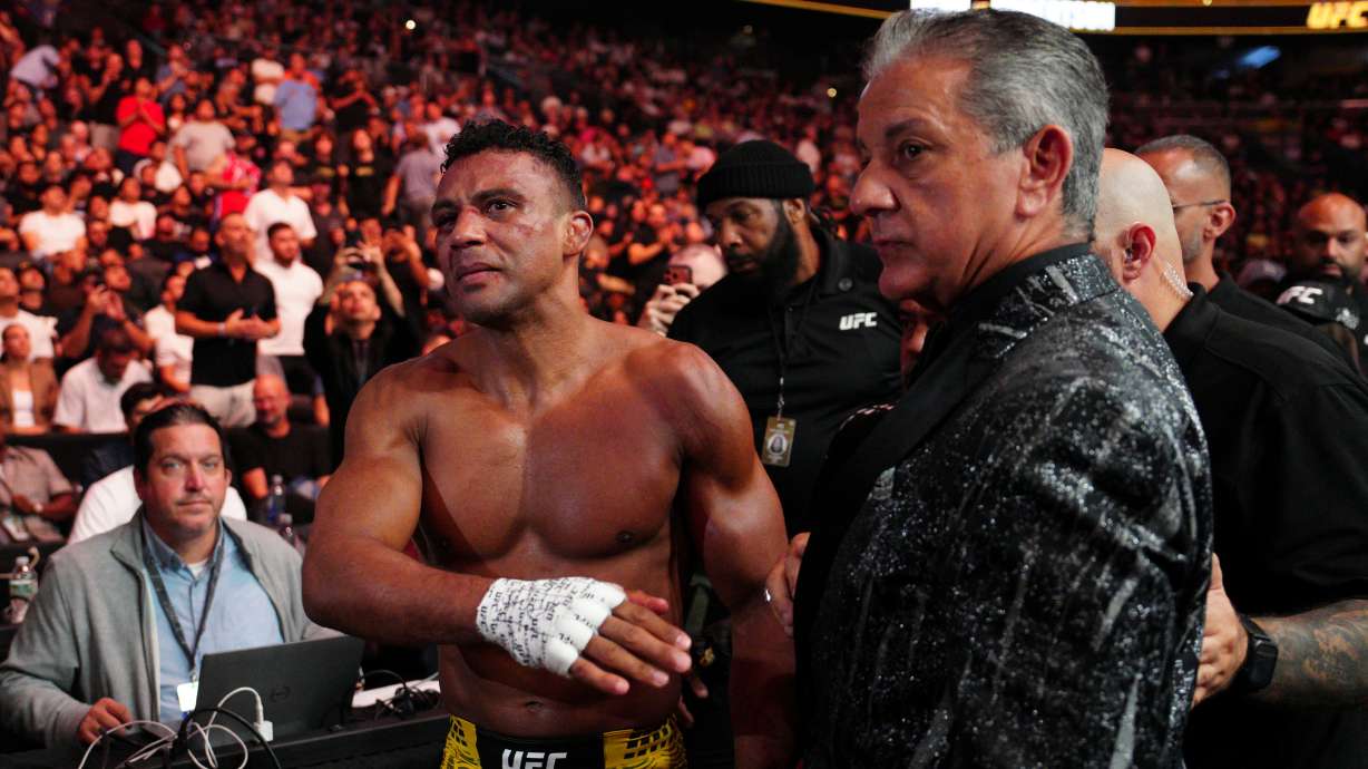 Edson Barboza, left, walks from the ring after a lightweight fight against Esteban Ribovics at the UFC 330 mixed martial arts event Saturday, Aug. 15, 2026, in Philadelphia.