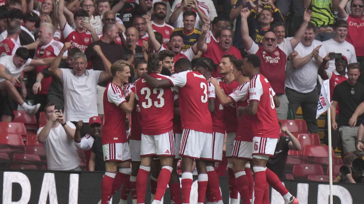Arsenal's Riccardo Calafiori celebrates with teammates after scoring the opening goal during the FA Community Shield final soccer match between Arsenal and Manchester City in Cardiff, Wales, Sunday, Aug.16, 2026.