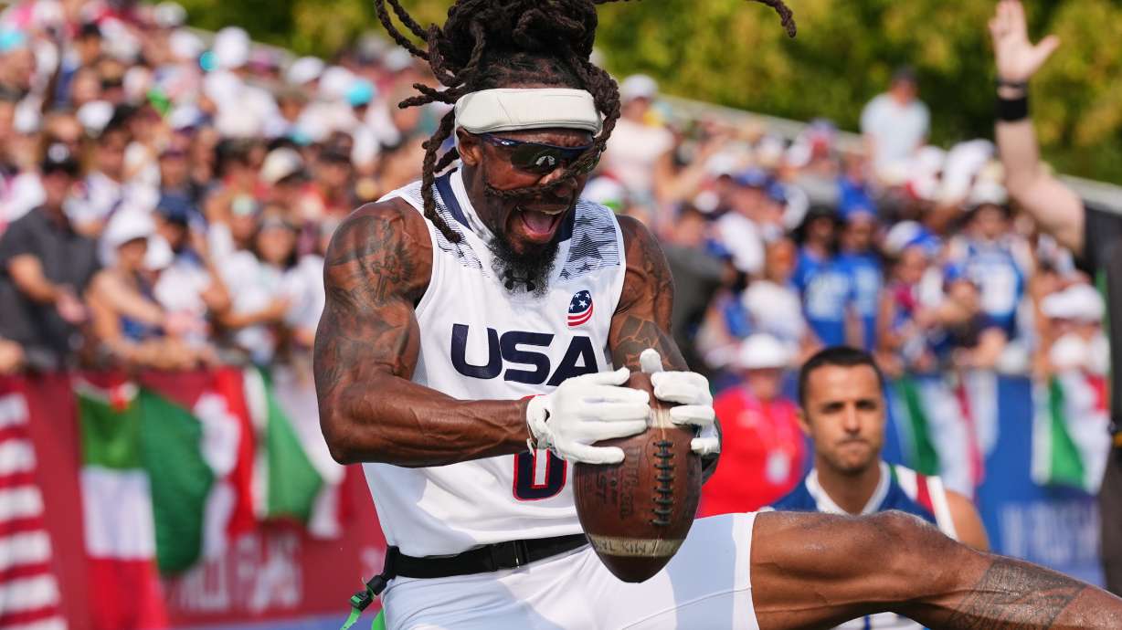 United States' Tyler "TD" Davis celebrates a touchdown during the Flag Football World Championship men's final game between Italy and USA in Duesseldorf, Germany, Sunday, Aug. 16, 2026.