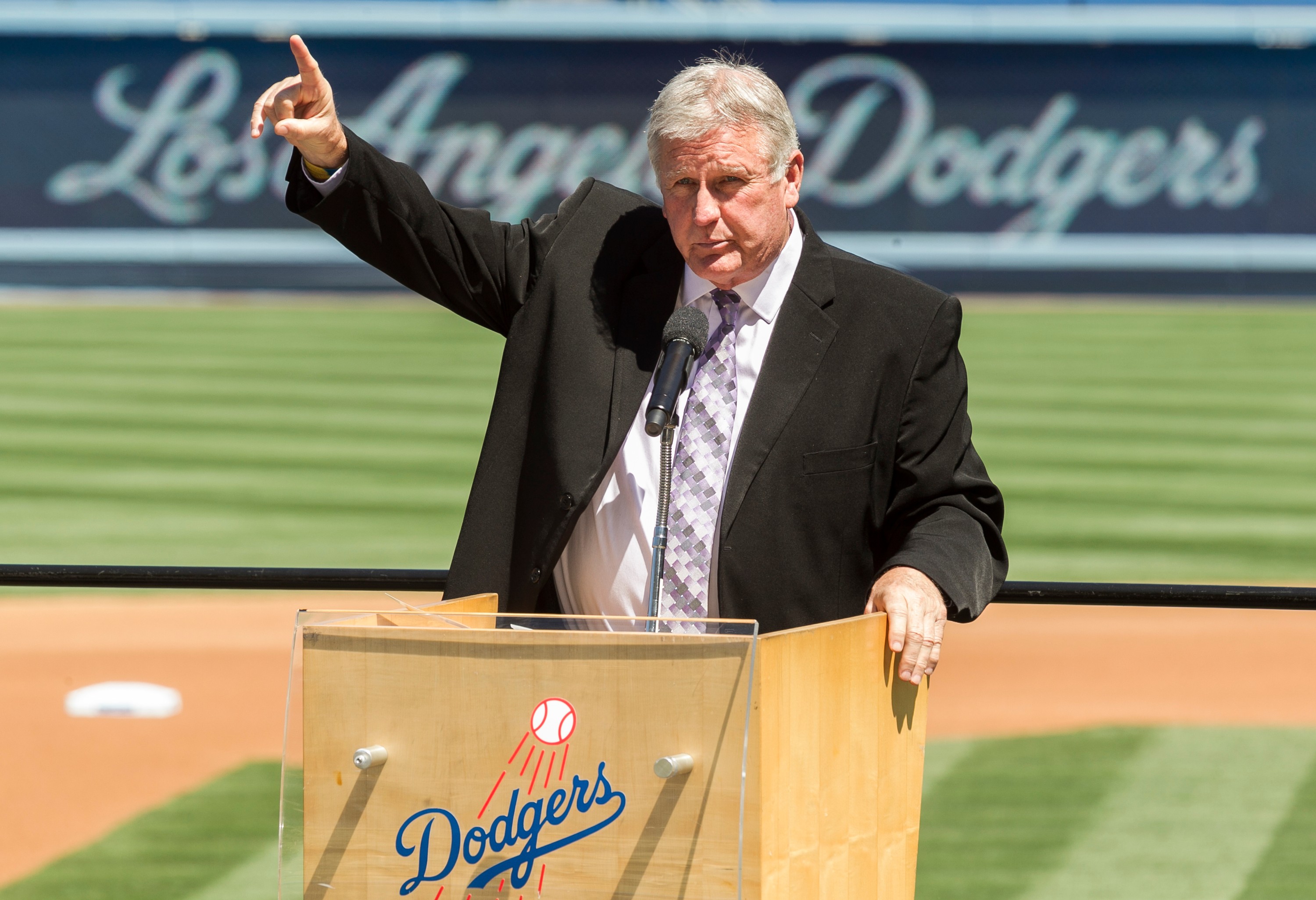 FILE - Los Angeles Dodgers former pitcher Tommy John praises his late friend, Dr. Frank Jobe during a memorial service at Dodger Stadium in Los Angeles, April 7, 2014. 