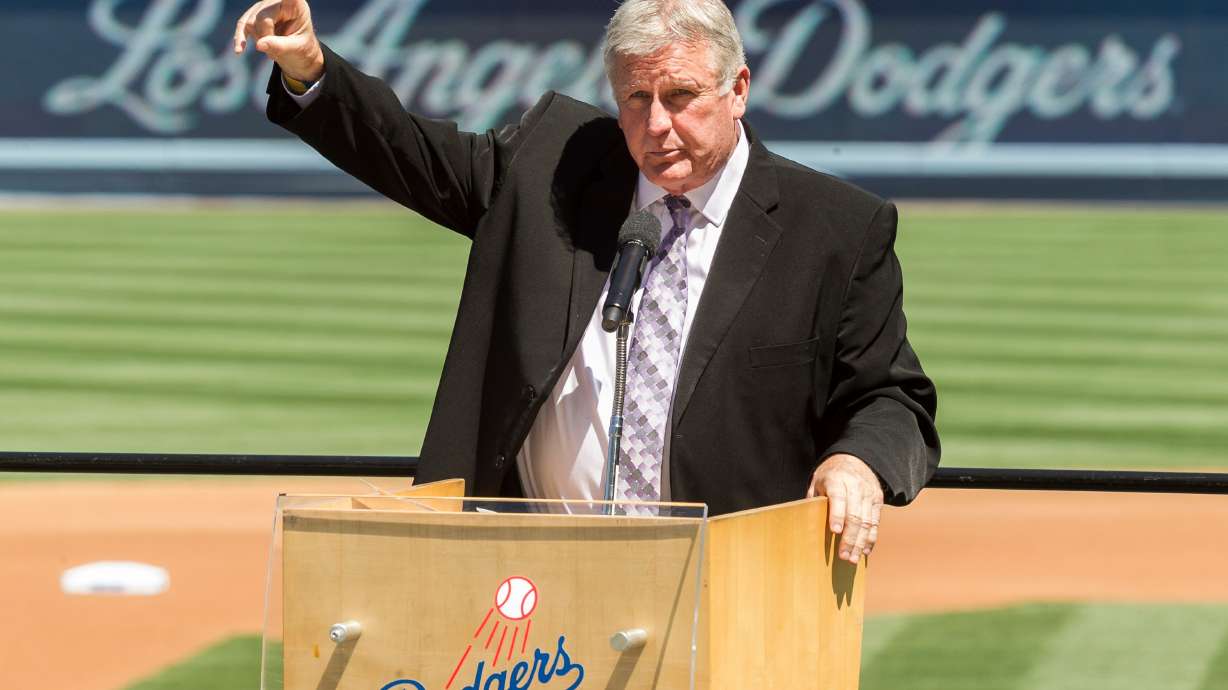 FILE - Los Angeles Dodgers former pitcher Tommy John praises his late friend, Dr. Frank Jobe during a memorial service at Dodger Stadium in Los Angeles, April 7, 2014.