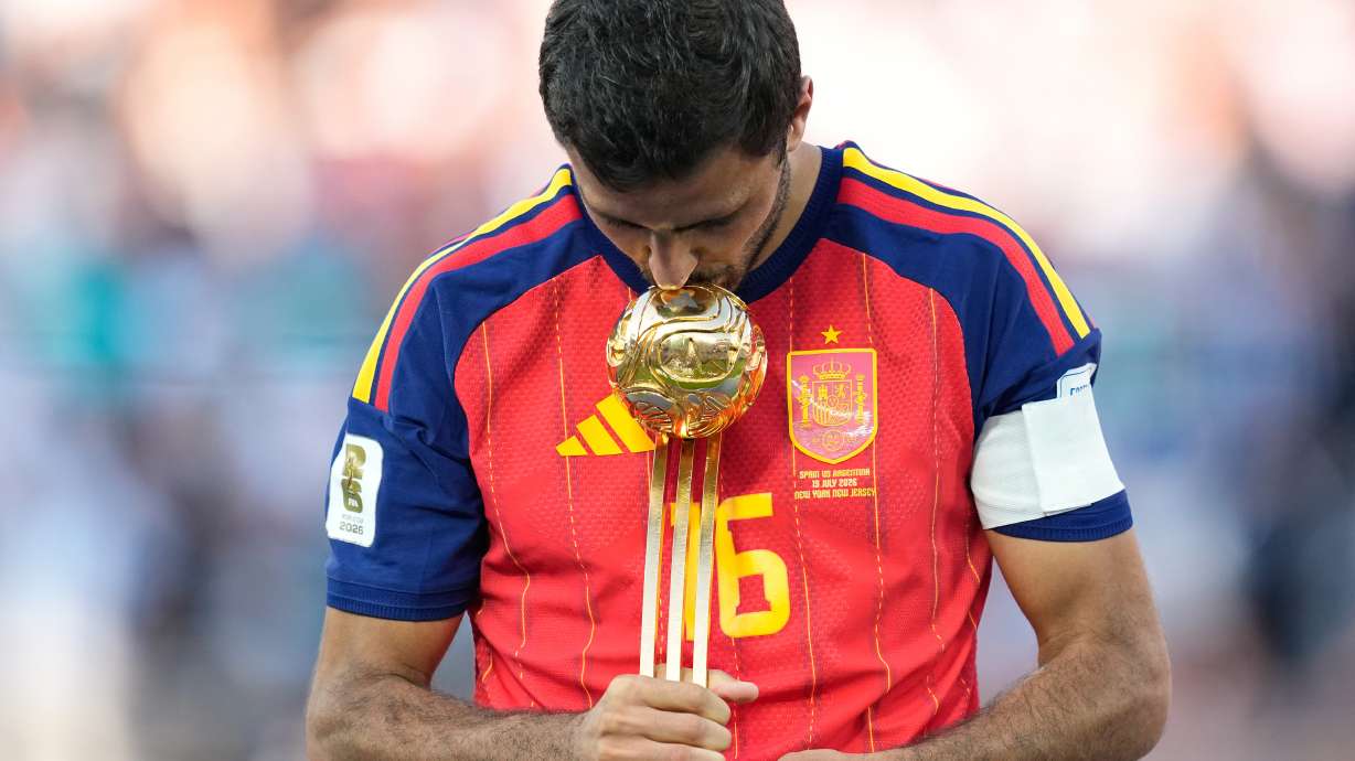 Spain's Rodri poses with the tournament's best player award at the end of the World Cup final soccer match between Spain and Argentina in East Rutherford, N.J., near New York, Sunday, July 19, 2026.
