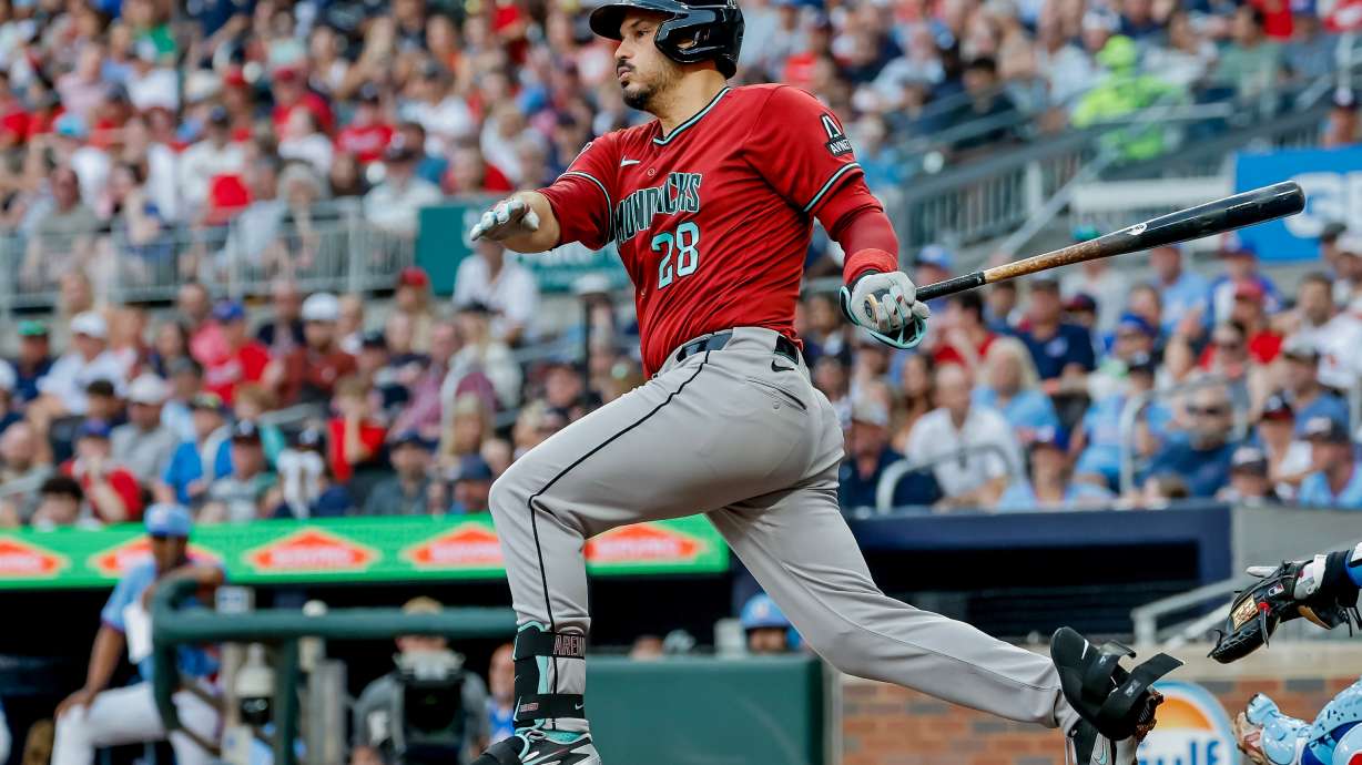 Arizona Diamondbacks third baseman Nolan Arenado (28) follows through on an RBI grounder against the Atlanta Braves during the second inning of a baseball game, Saturday, August 15, 2026, in Atlanta.