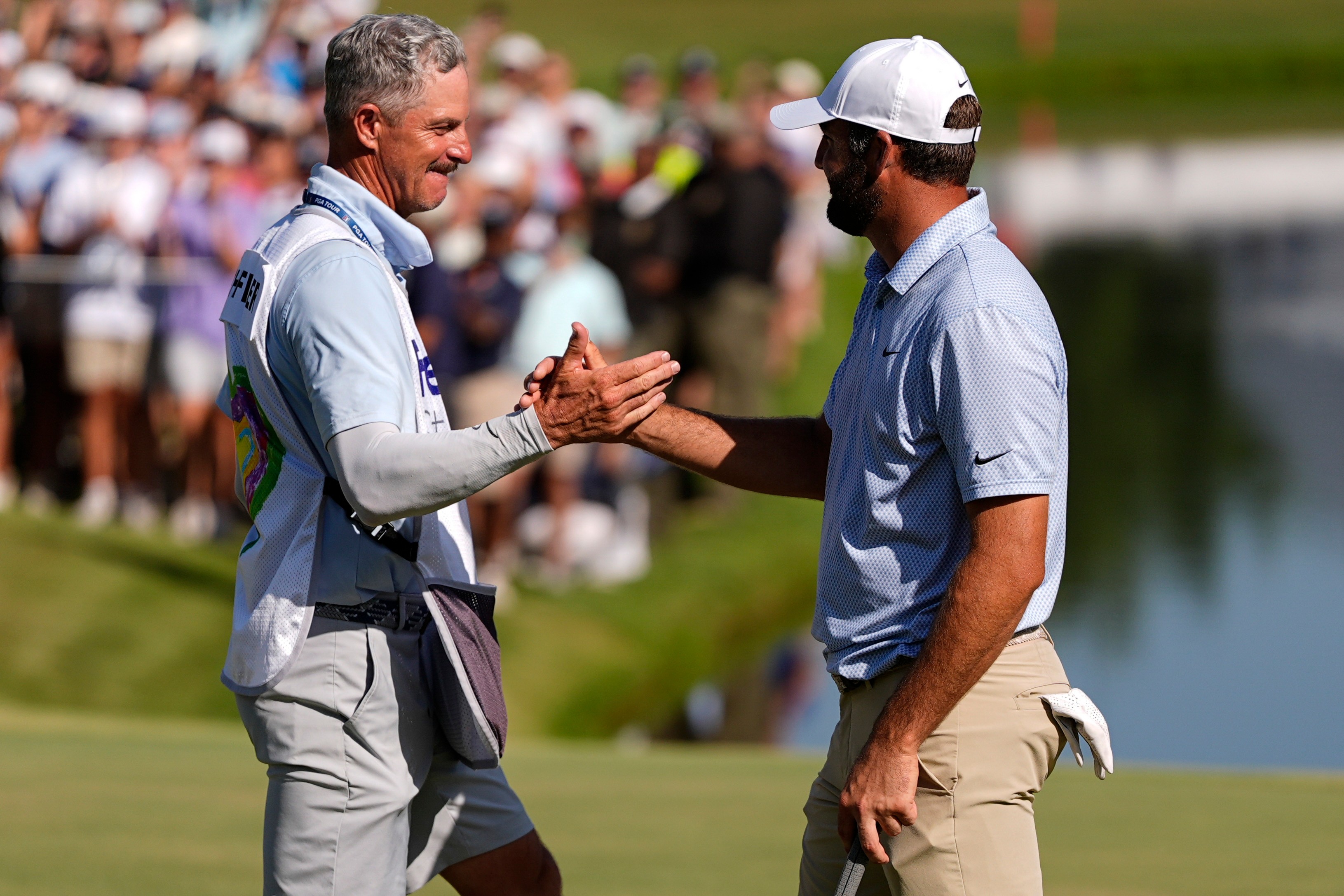 Scottie Scheffler celebrates winning on the 18th green the final round of the St. Jude Championship golf tournament, Sunday, Aug. 16, 2026, in Memphis, Tenn. 