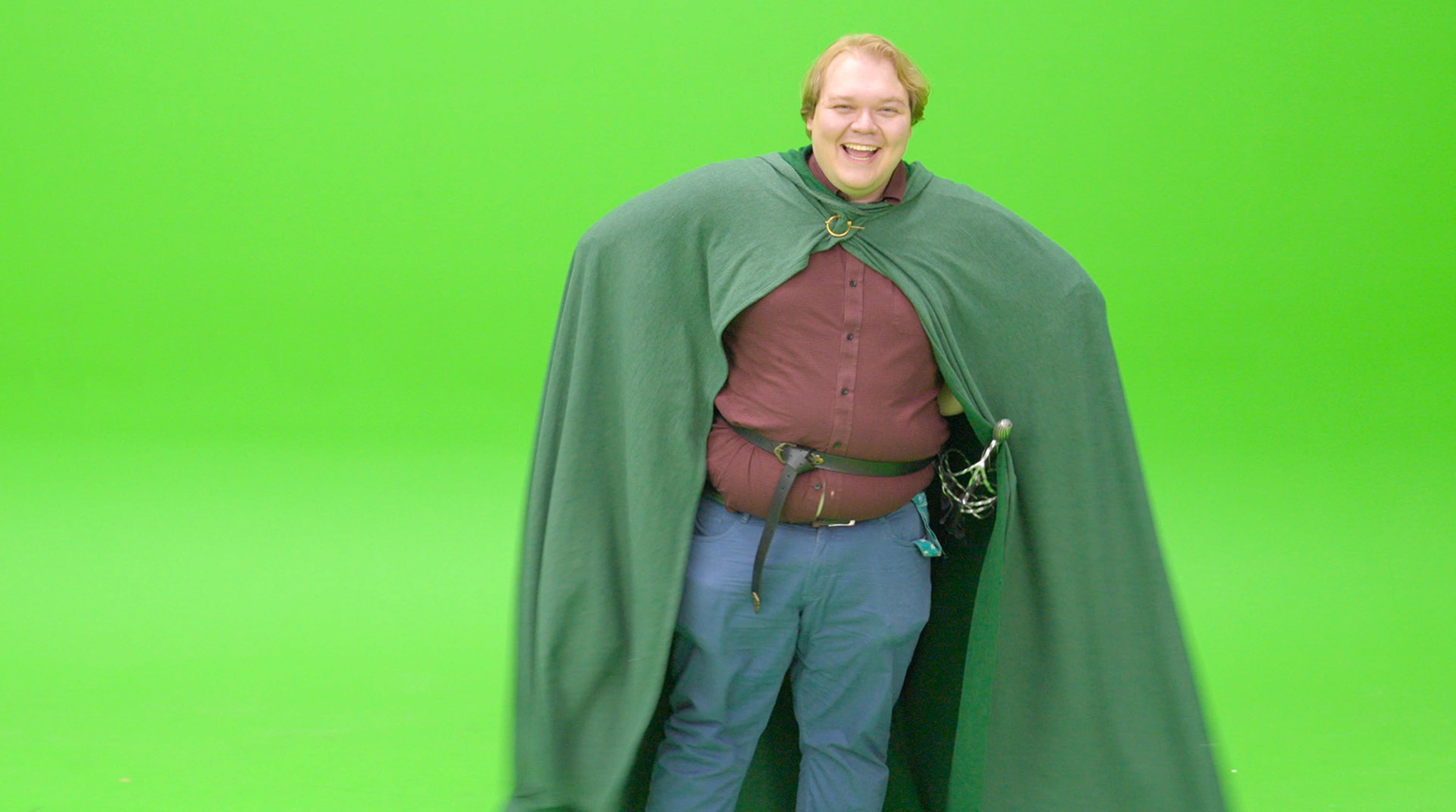 Ethan Van Valkenburg, who participated in a Utah-based dating campaign, laughs as he shoots a video in front of a green screen.