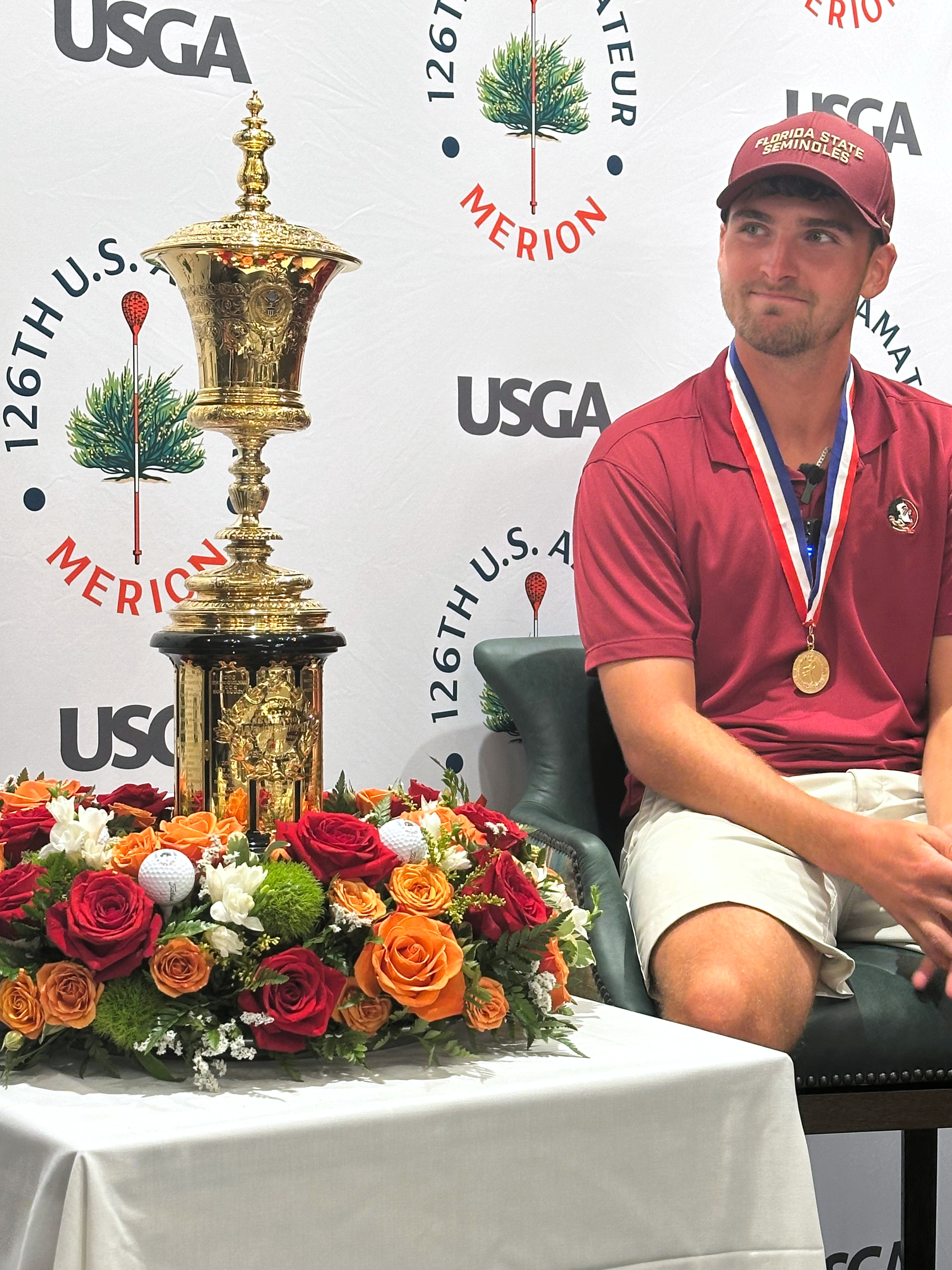 Jack Whaley admires his US Amateur golf championship trophy Sunday, Aug. 16, 2026, at Merion Golf Club in Ardmore, Pa. 