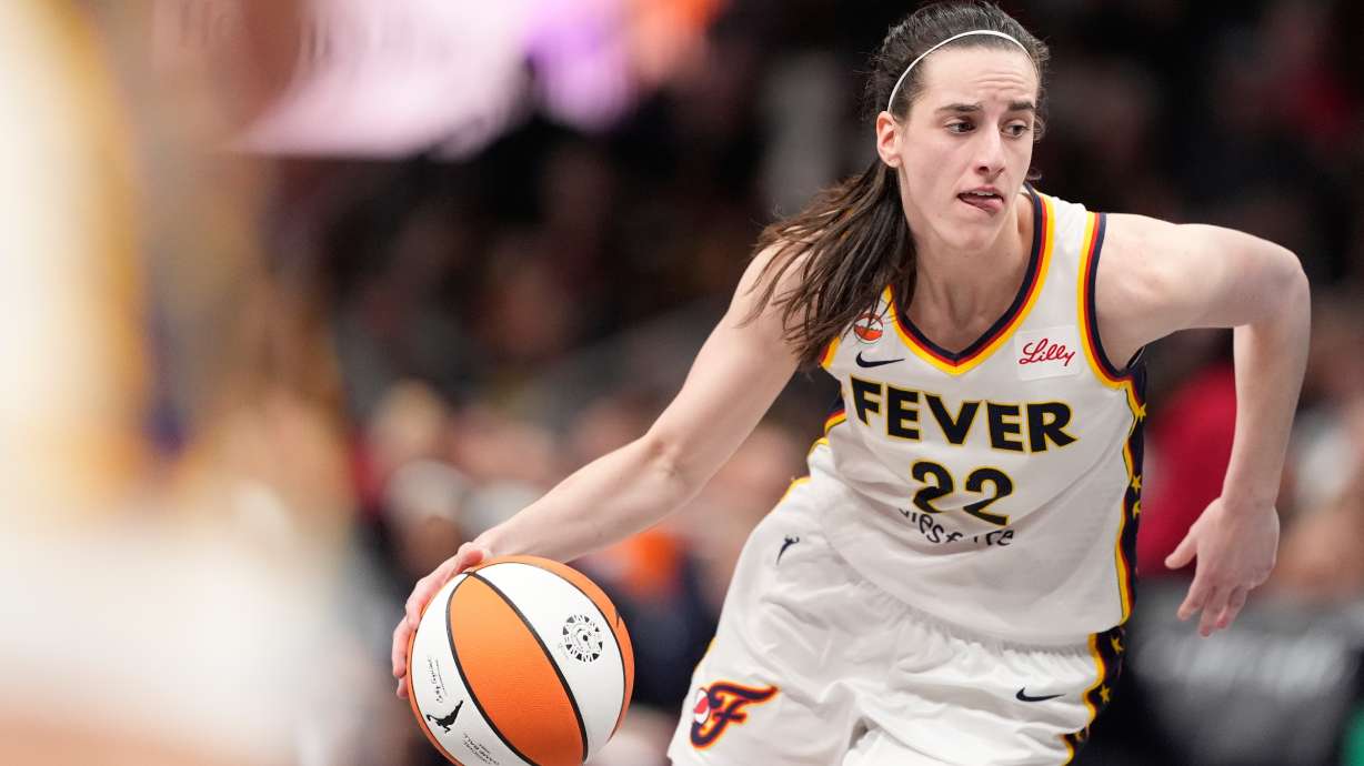 Indiana Fever guard Caitlin Clark (22) dribbles the ball in the second half of an WNBA basketball game against the Atlanta Dream Sunday, Aug. 16, 2026, in Atlanta.