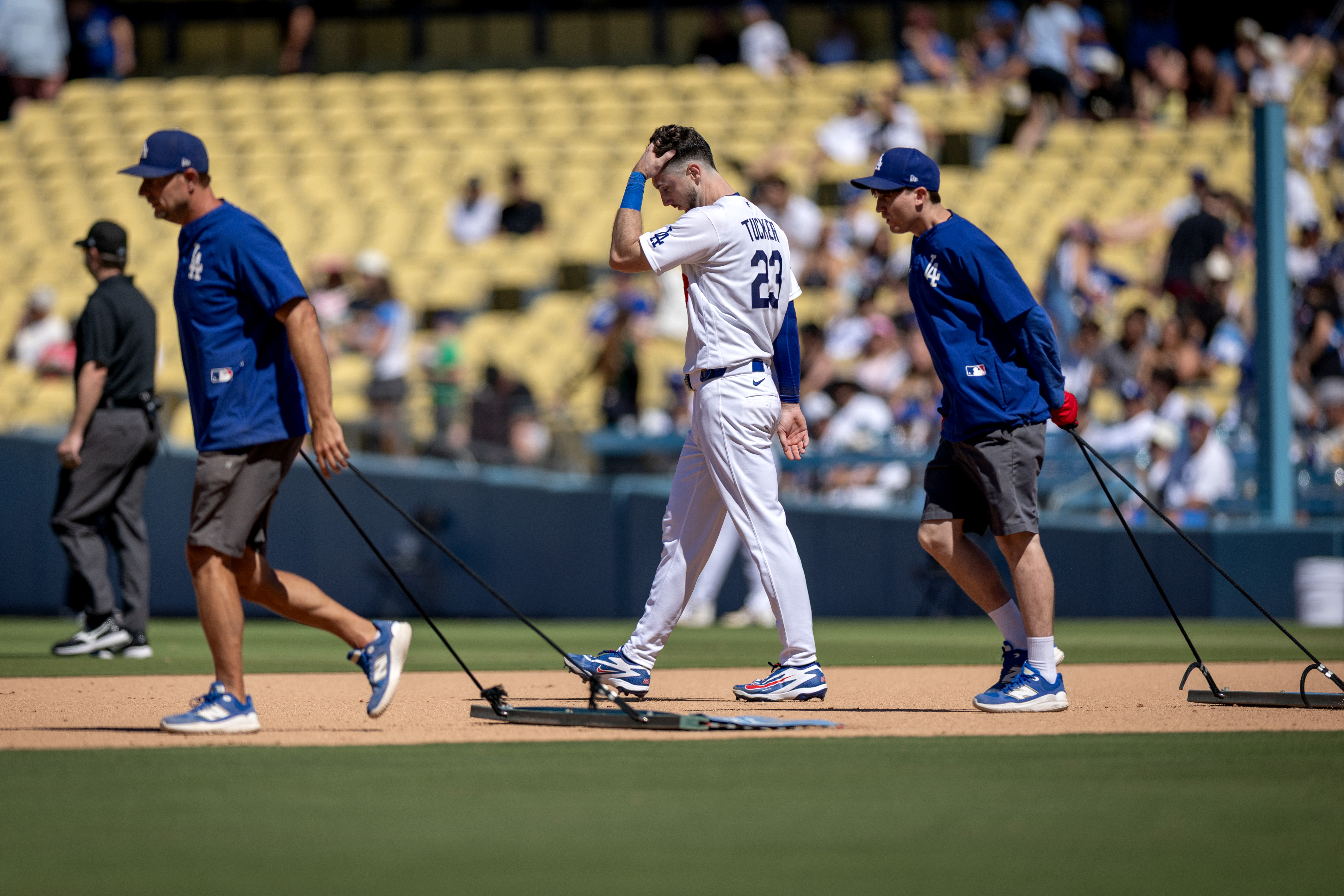 Los Angeles Dodgers' Kyle Tucker (23) walks to the outfield after grounding out during the seventh inning of a baseball game against the Milwaukee Brewers, Sunday, Aug. 16, 2026, in Los Angeles. 