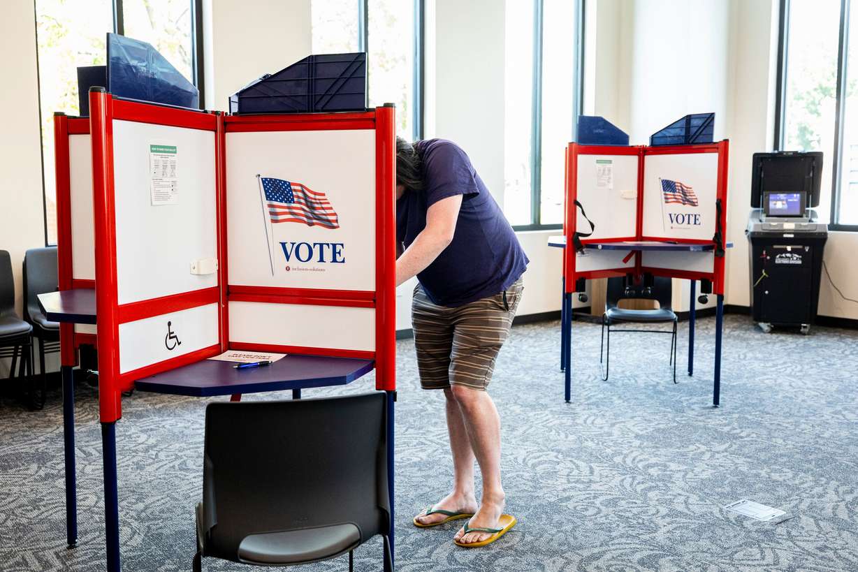 A voter fills out their ballot as part of Utah’s primary election at the Lehi Civic Center on June 23.