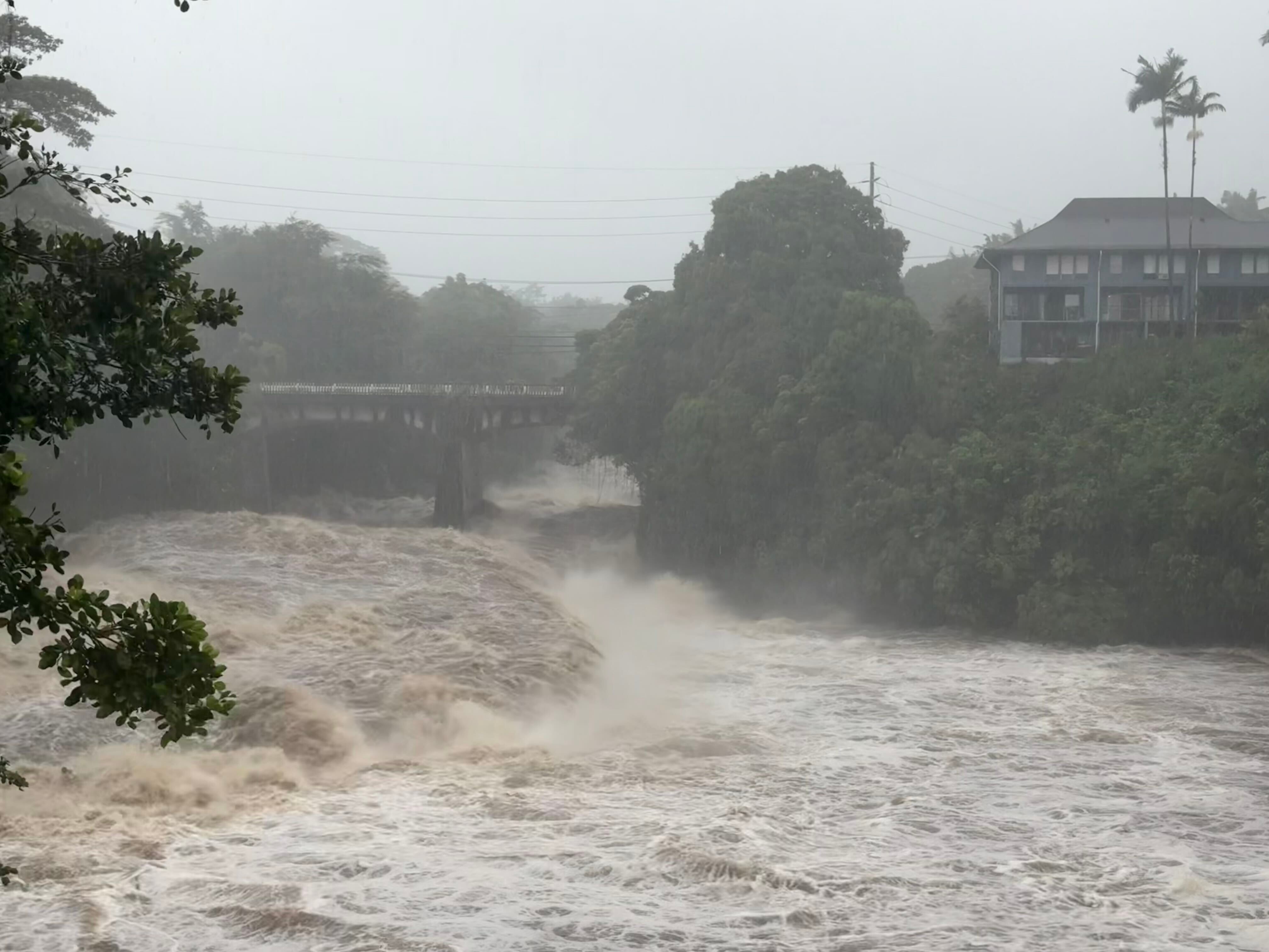 A view of the rising water levels at the Wainaku Street Bridge in Hilo on the Big Island of Hawaii, Aug. 15. A strengthening Tropical Storm Nolo could potentially bring devastating rainfall to the island again this weekend.