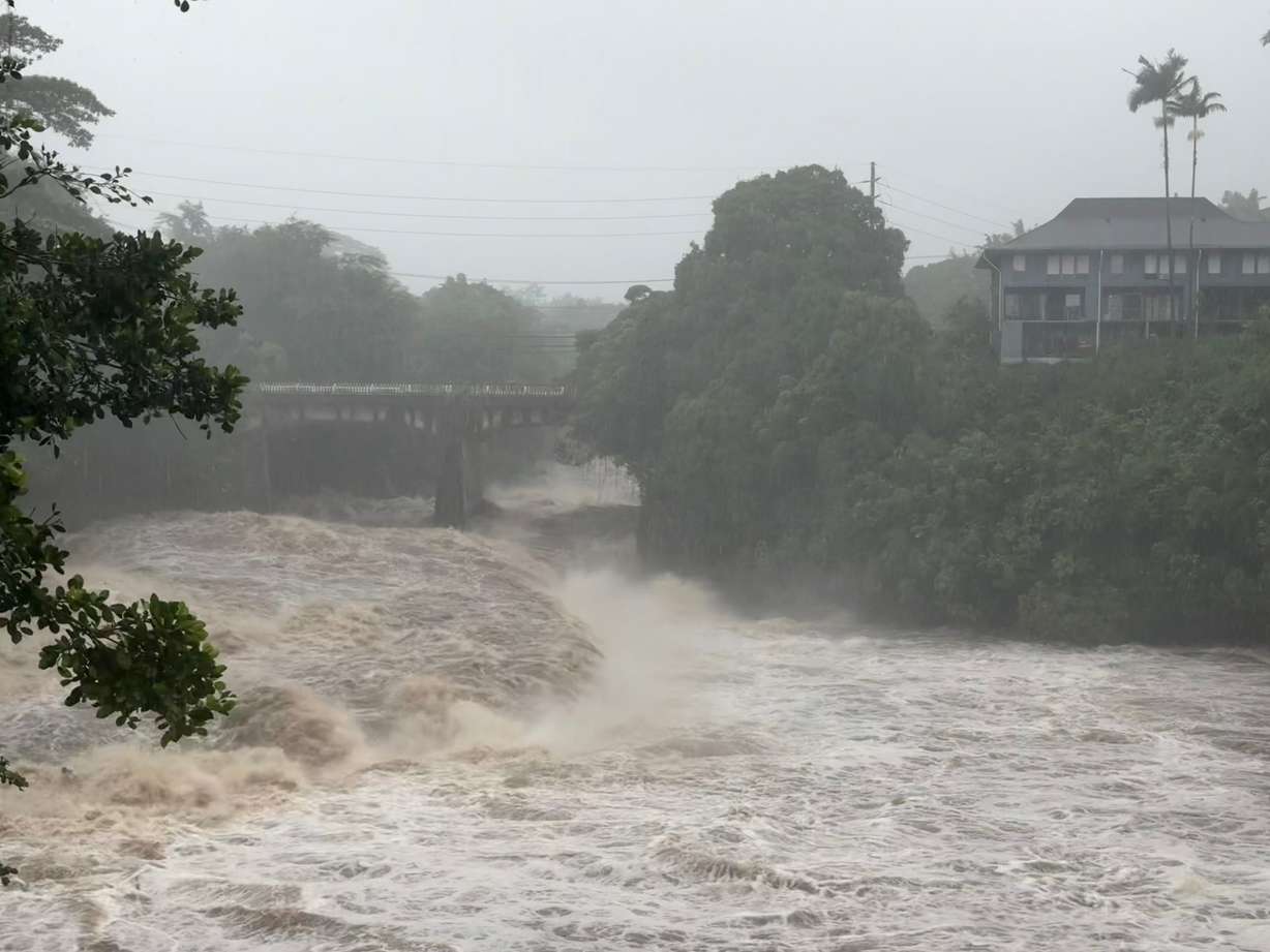 A view of the rising water levels at the Wainaku Street Bridge in Hilo on the Big Island of Hawaii, Aug. 15. A strengthening Tropical Storm Nolo could potentially bring devastating rainfall to the island again this weekend.