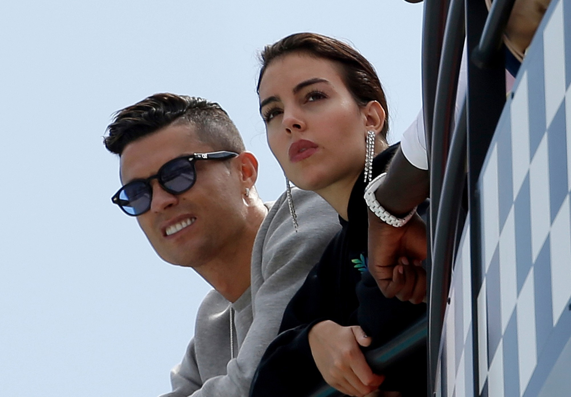 FILE - Cristiano Ronaldo, left, and his partner Georgina Rodriguez watch the second practice session at the Monaco racetrack, in Monaco, May 23, 2019. 