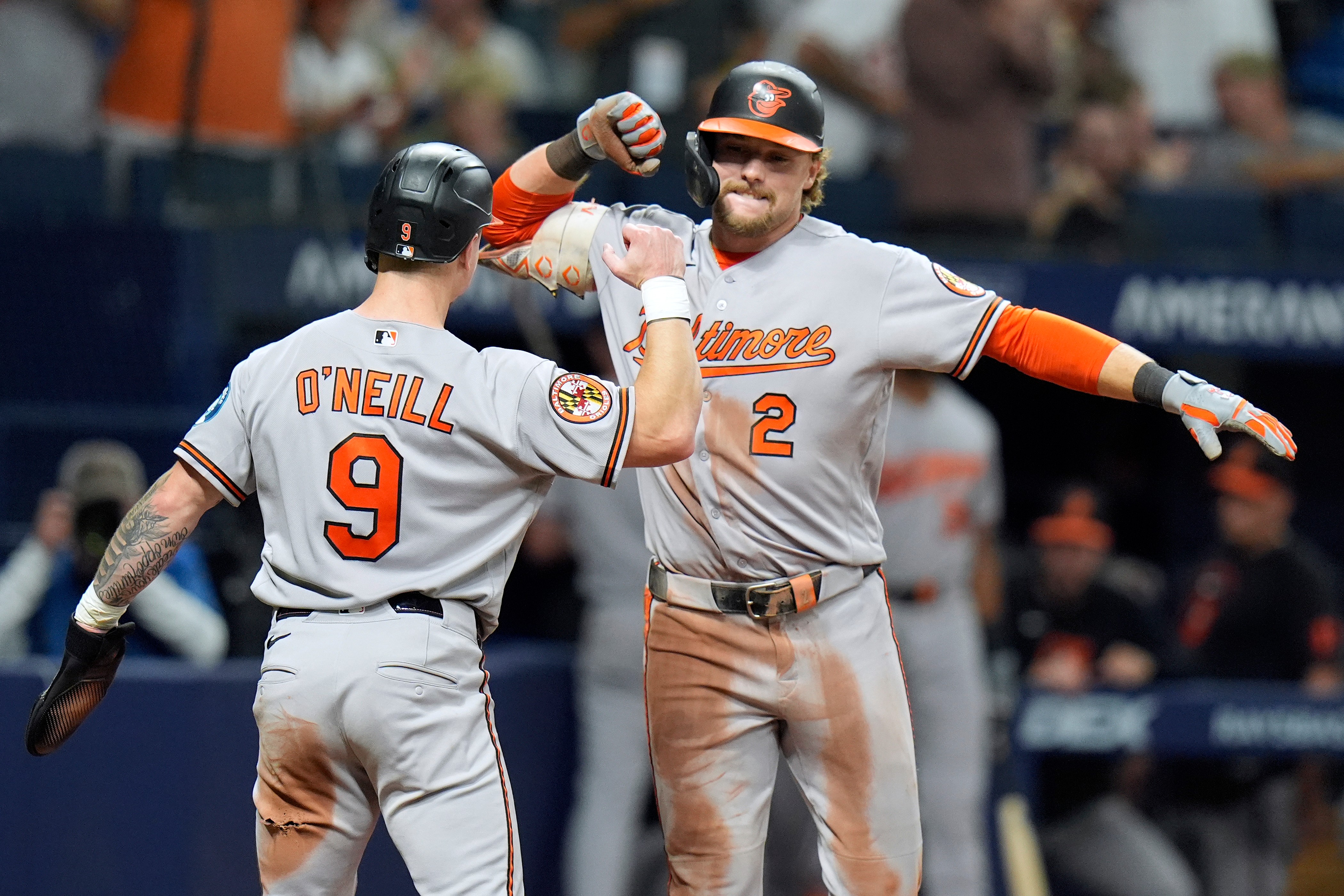 Baltimore Orioles' Gunnar Henderson (2) celebrates his two-run home run off Tampa Bay Rays pitcher Chris Roycroft with Tyler O'Neill (9) during the eighth inning of a baseball game Friday, Aug. 14, 2026, in St. Petersburg, Fla. 