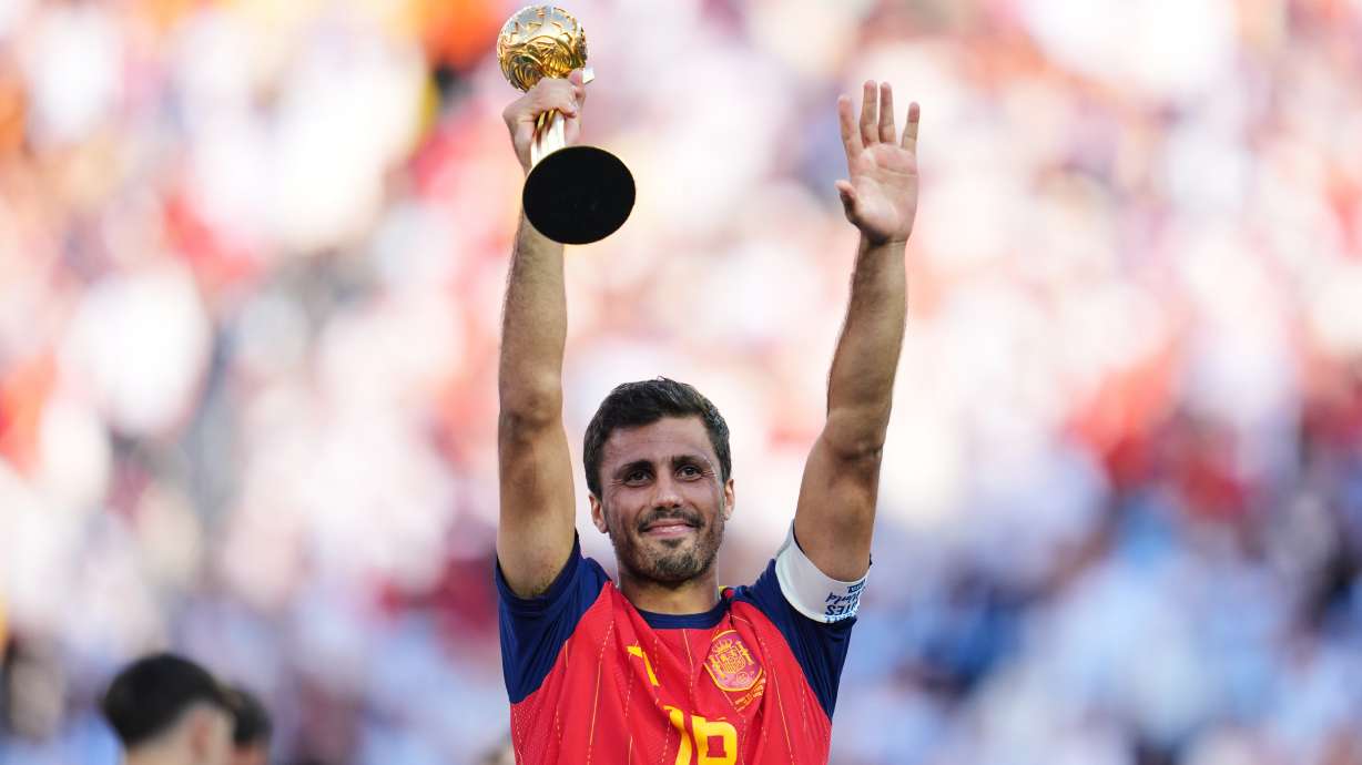 Spain's Rodri celebrates with the tournament's best player award after the World Cup final soccer match between Spain and Argentina in East Rutherford, N.J., near New York, Sunday, July 19, 2026.