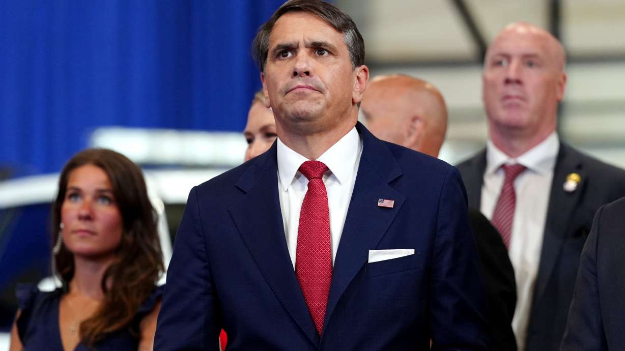 Attorney General Todd Blanche listens as President Donald Trump speaks at the David Mack Center for Training and Intelligence, Friday in Garden City, N.Y.